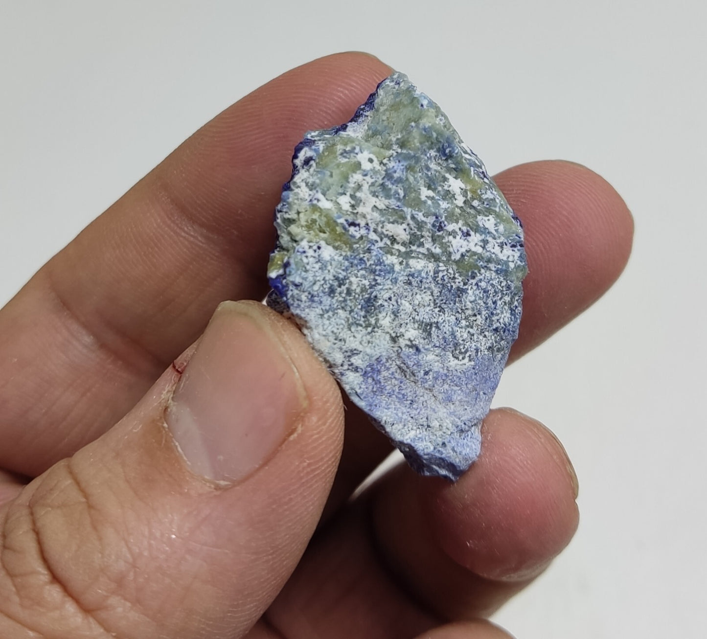 An Aesthetic specimen of fluorescent Lazurite with pyrite 25 grams