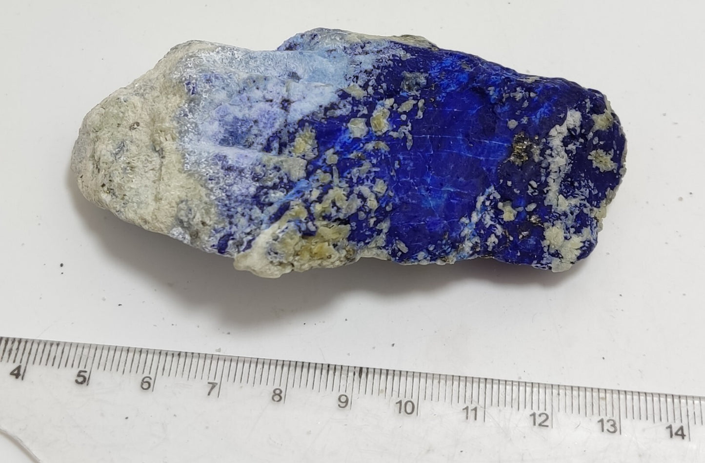 An Aesthetic specimen of fluorescent Lazurite with Pyrite 128 grams