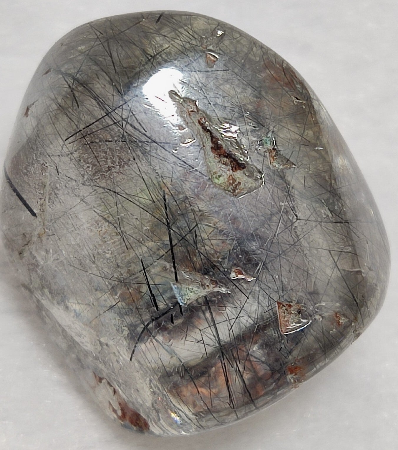 Single piece Rutiles/riebeckite/aegirine included quartz tumble 94 carats