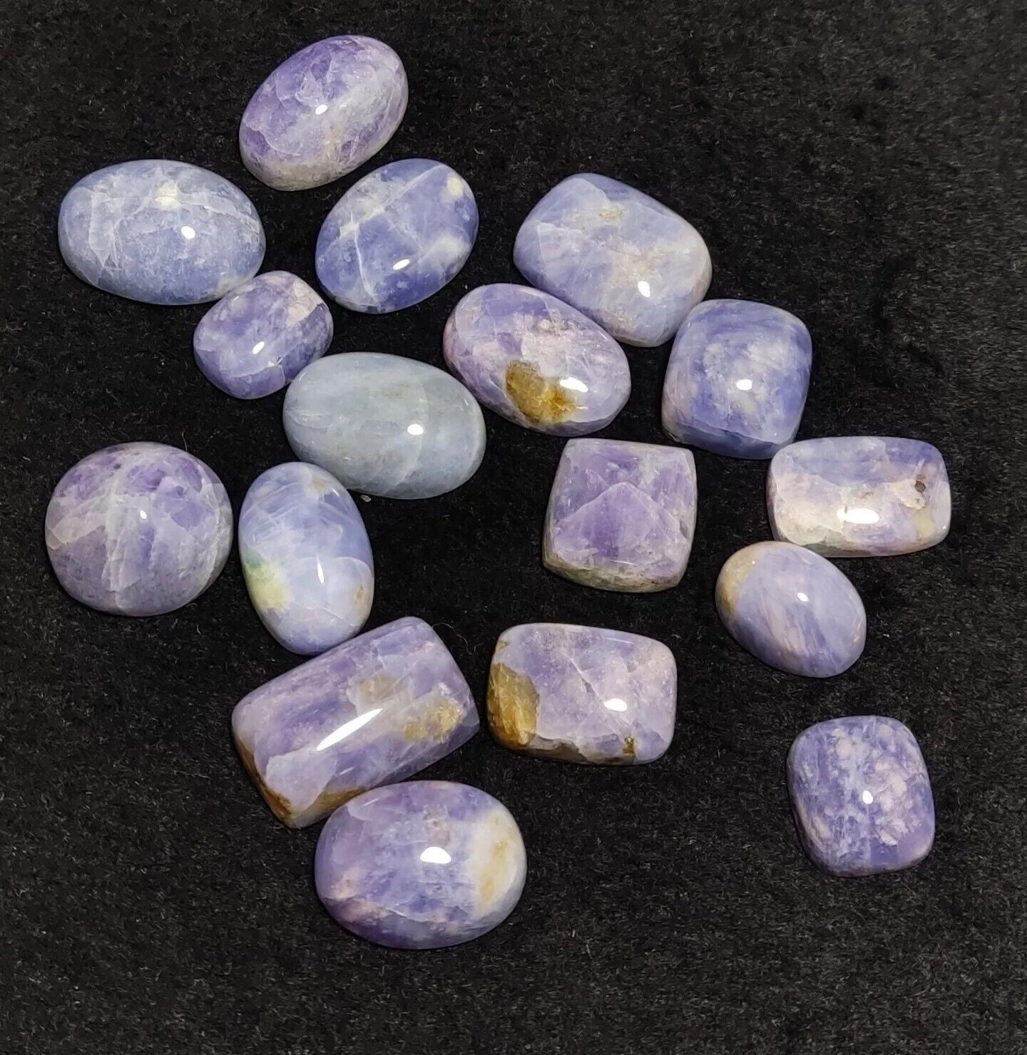 17 pieces Hackmanite cabochons  fluorescent collective weight 350 carats