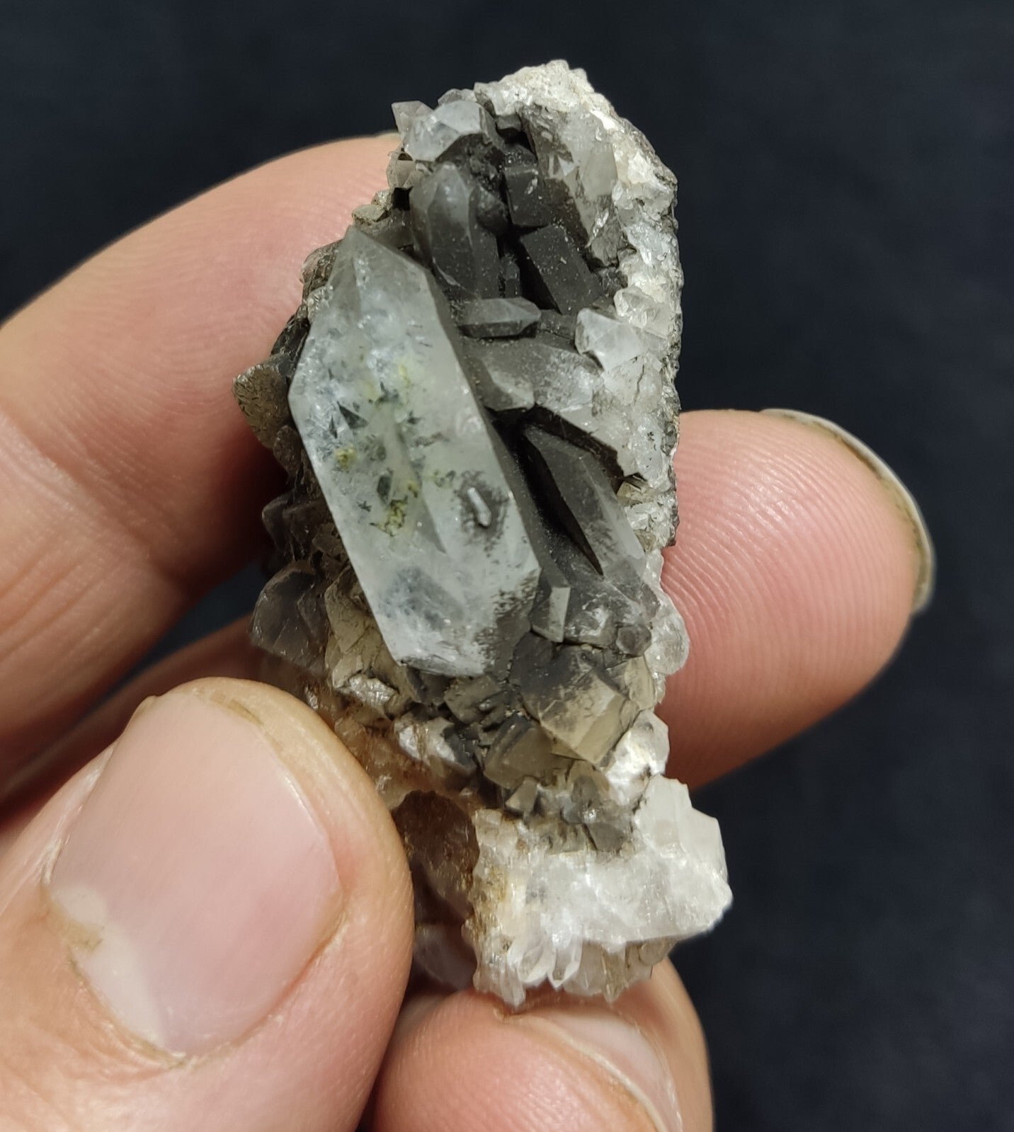 An Aesthetic quartz/calcite crystal specimen with petroleum inclusions 23 grams