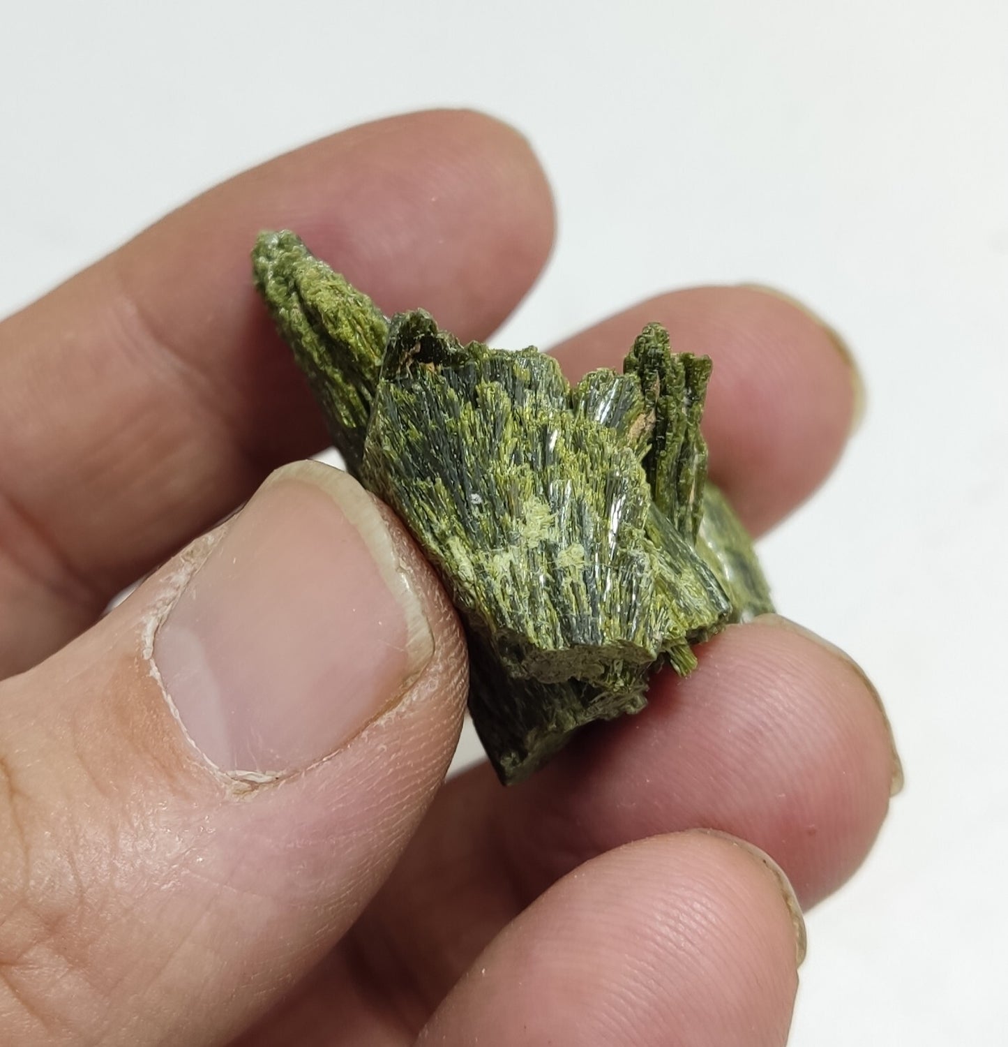 An aesthetic specimen of epidote crystal spray type 27 grams