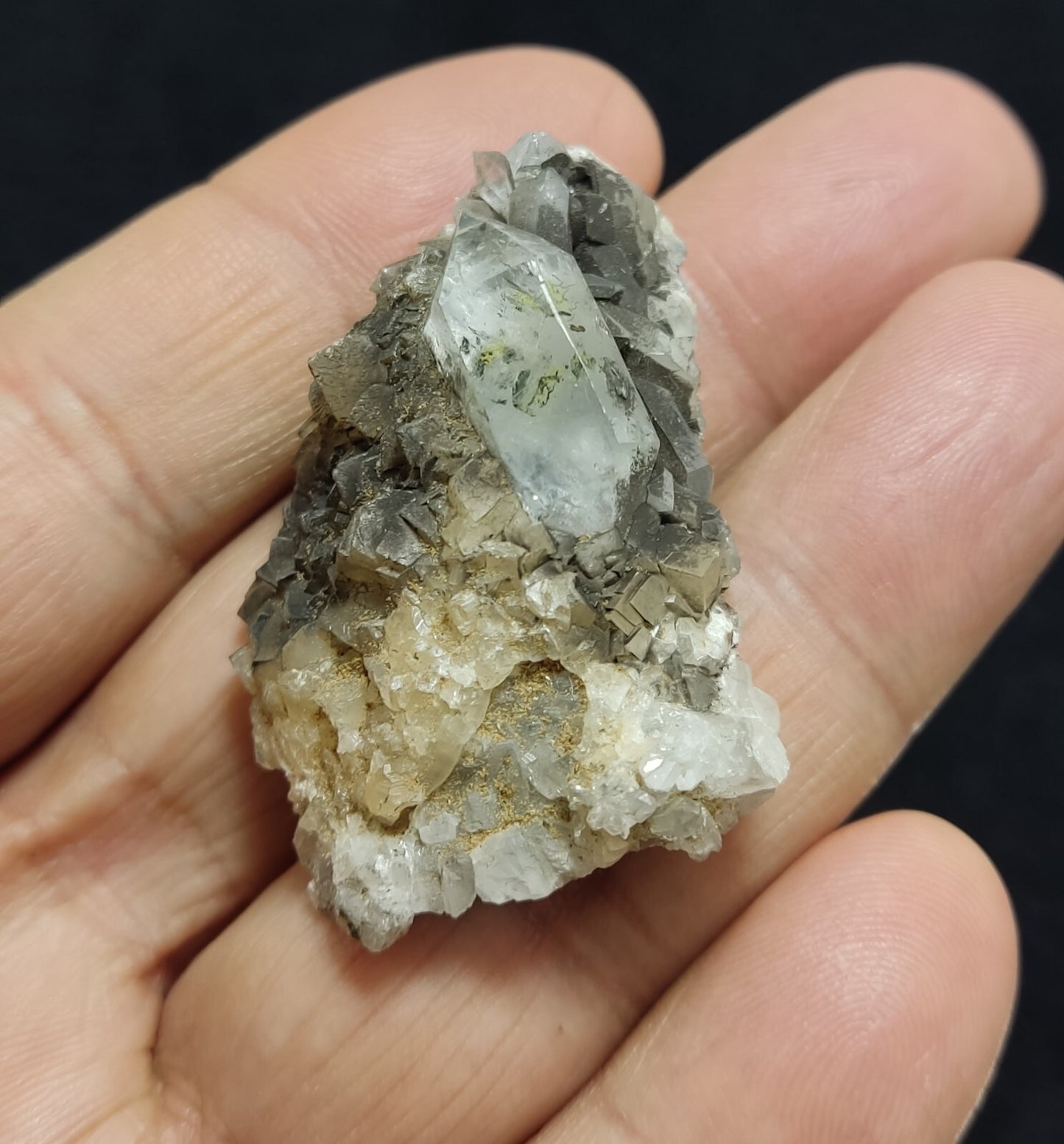 An Aesthetic quartz/calcite crystal specimen with petroleum inclusions 23 grams