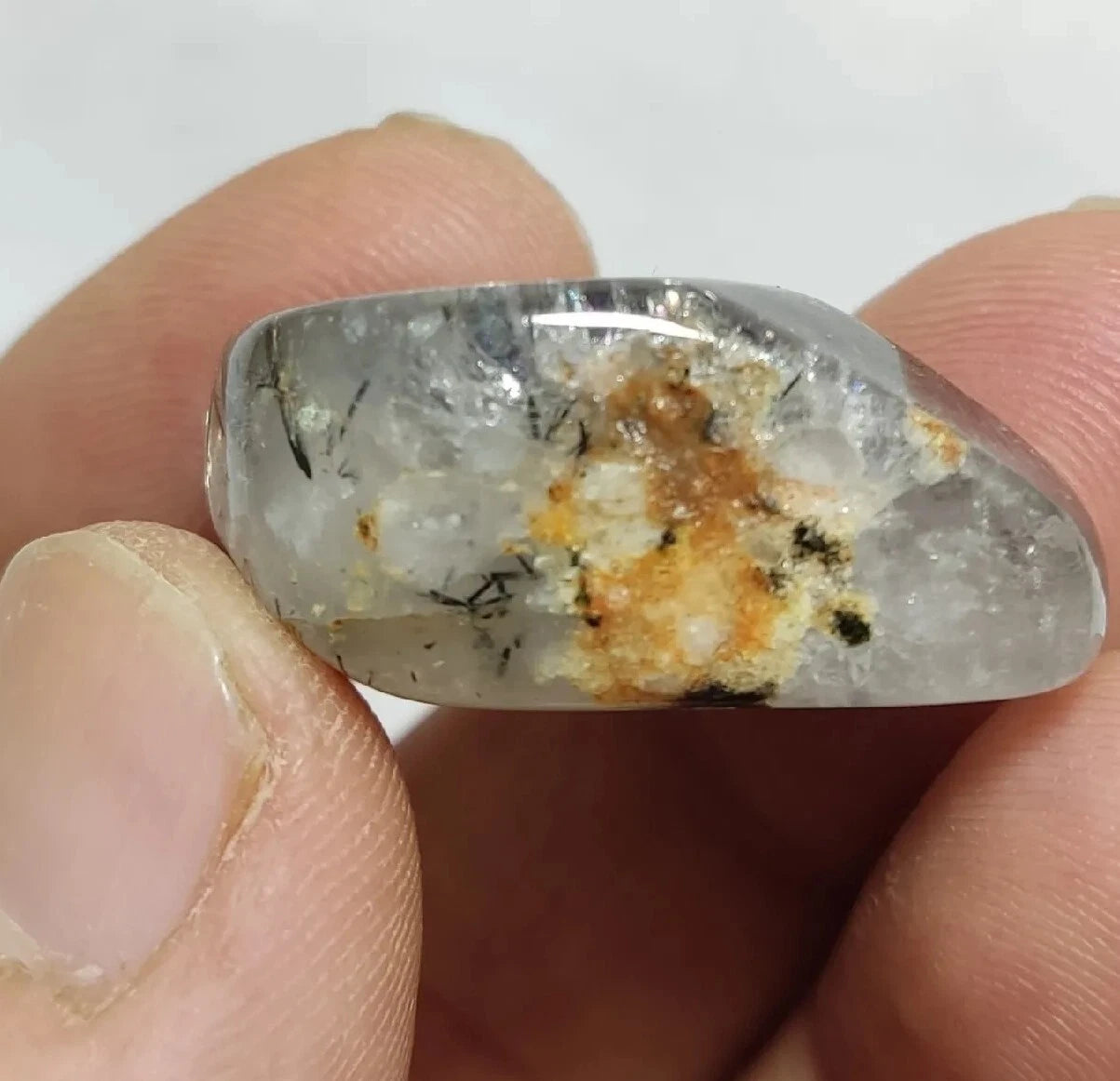 Rutiles/aegirine/ Unconfirmed quartz polished tumble 75 carats