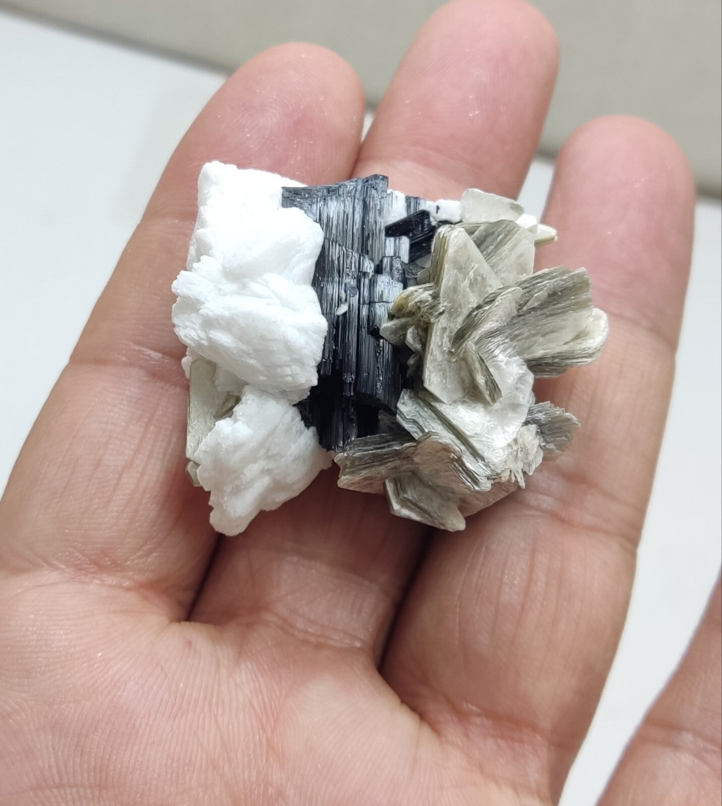 An Aesthetic specimen of muscovite with Tourmaline and albite 40 grams