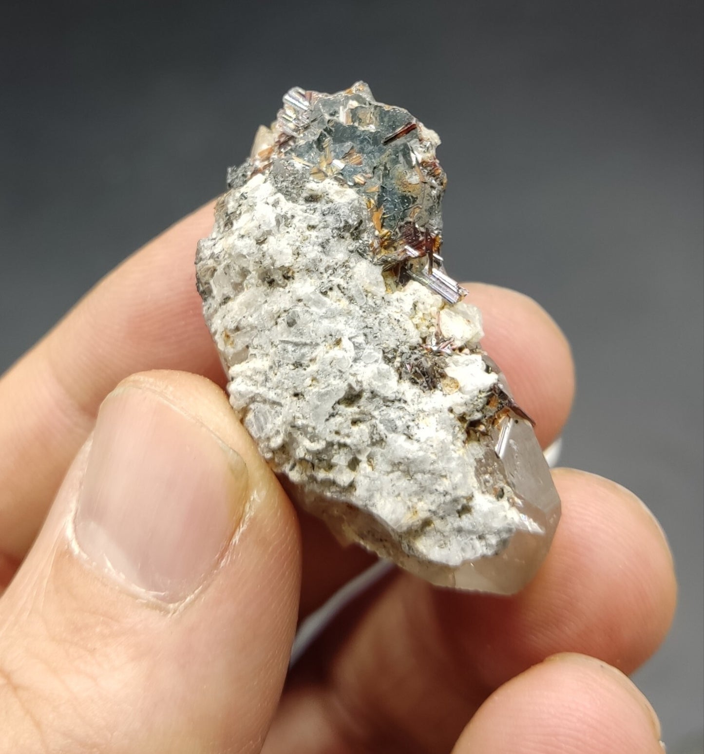 An Aesthetic specimen of quartz crystal with hematite and saginite 16 grams