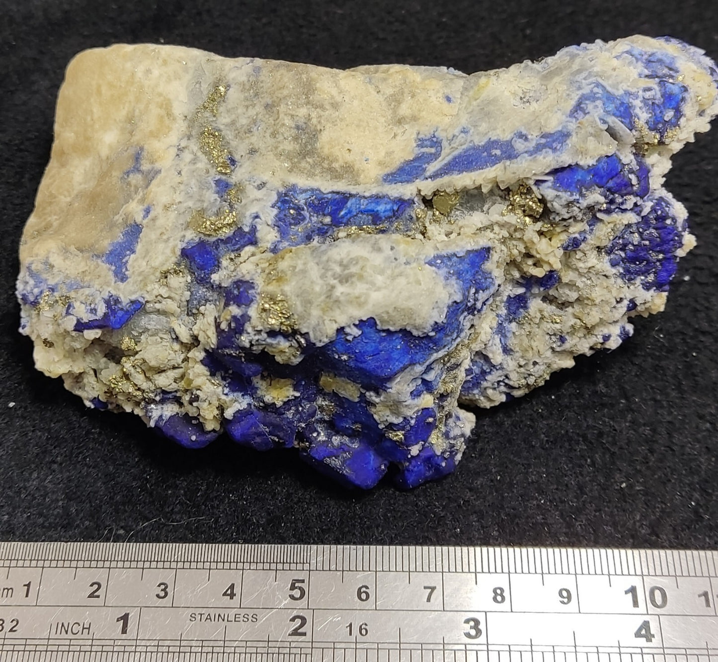 An Aesthetic specimen of fluorescent Lazurite with pyrite 489 grams