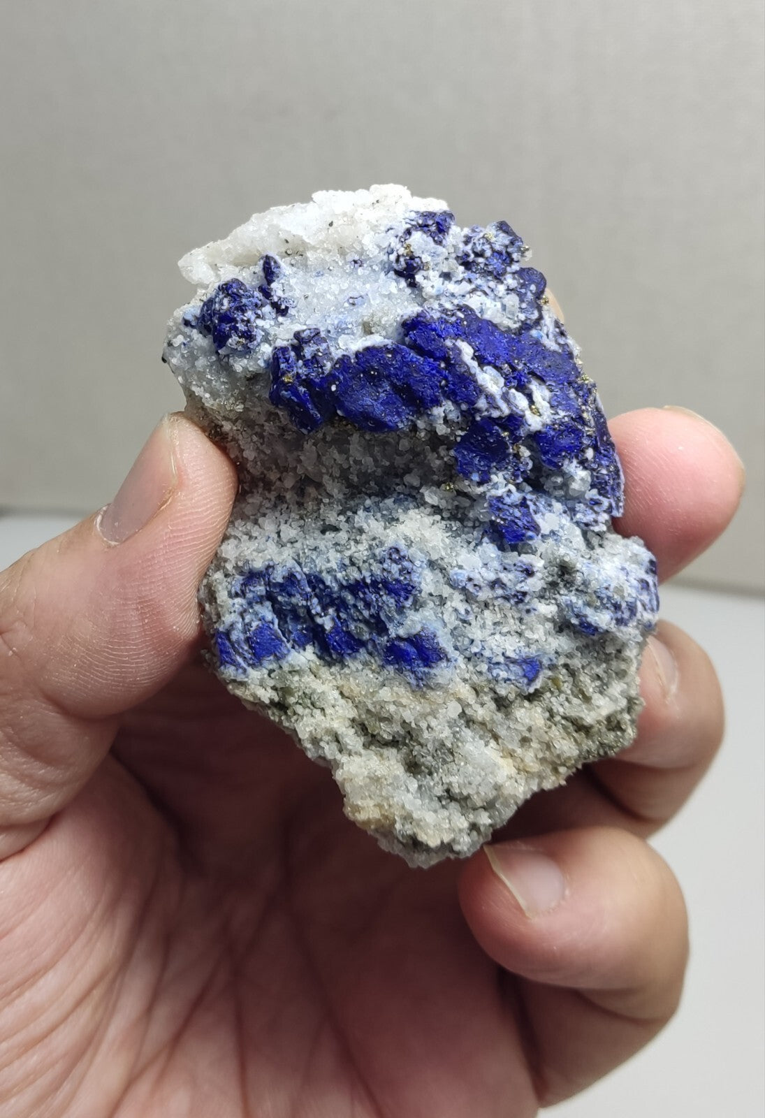 An Aesthetic specimen of fluorescent Lazurite with pyrite 112 grams