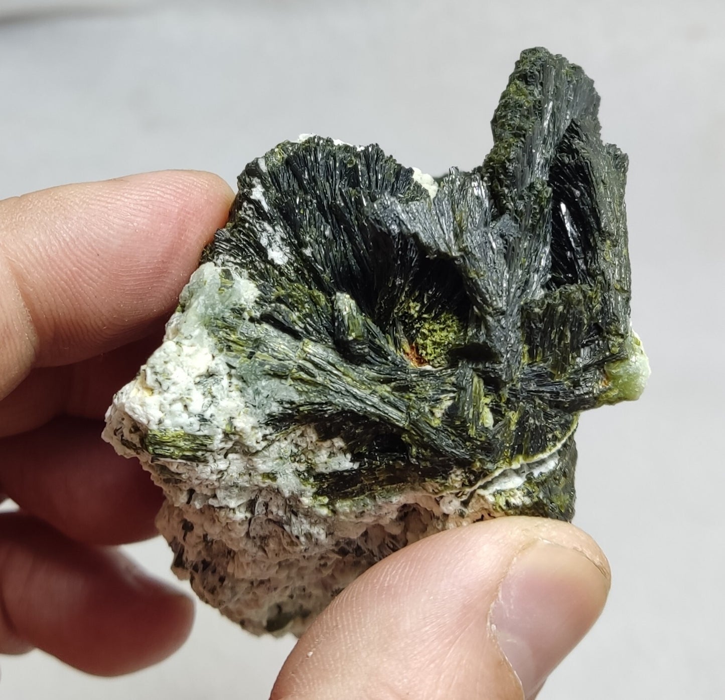 An aesthetic specimen of epidote crystal spray type on matrix 182 grams