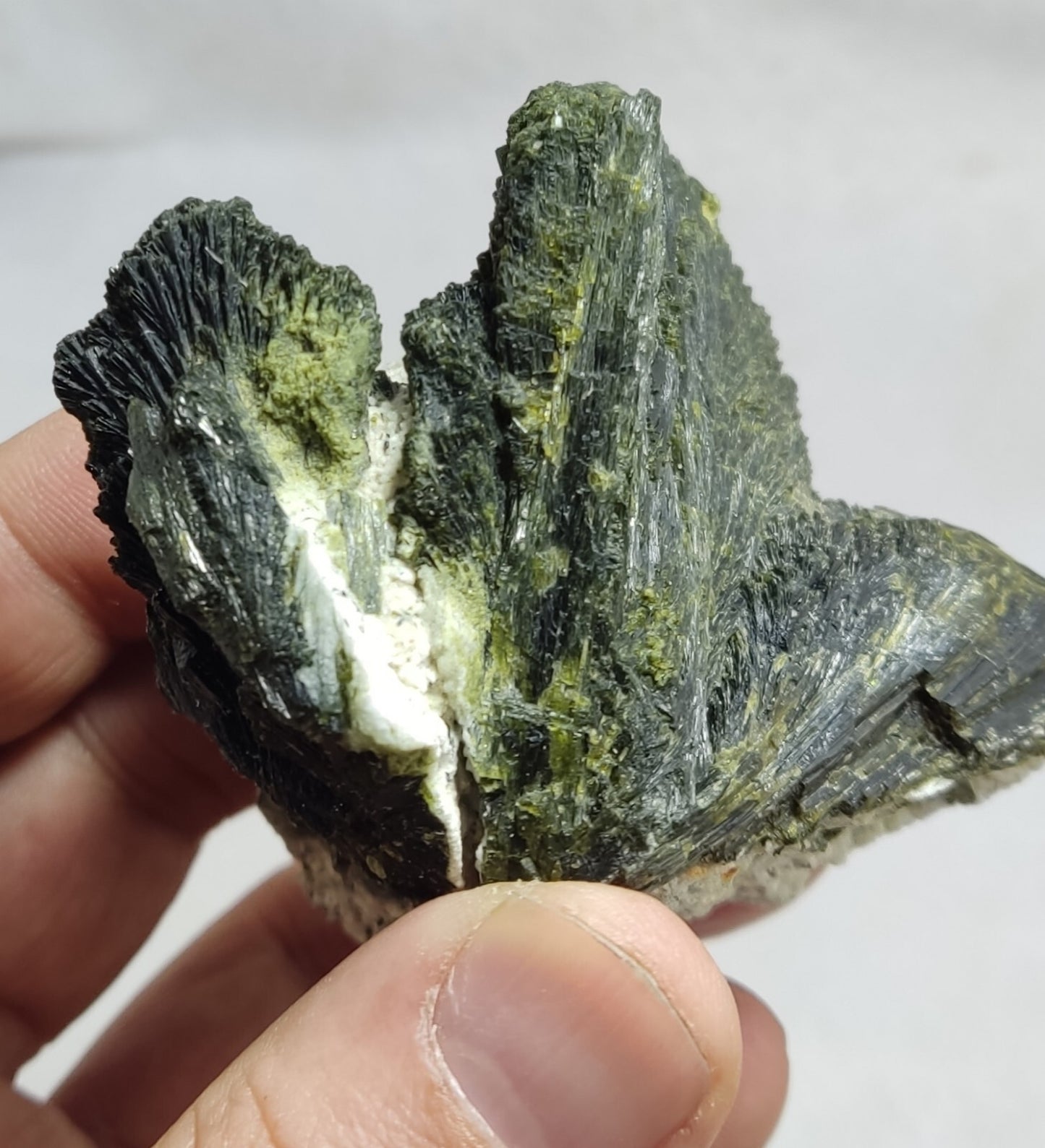 An aesthetic specimen of epidote crystal spray type on matrix 182 grams