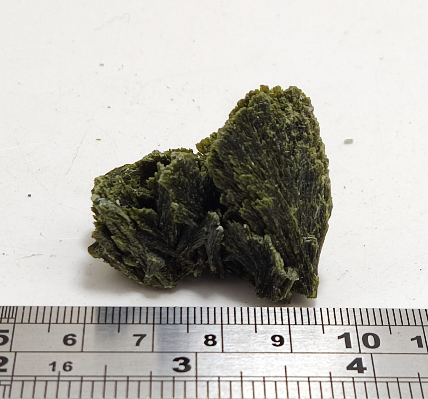 An aesthetic specimen of epidote crystal spray type 24 grams