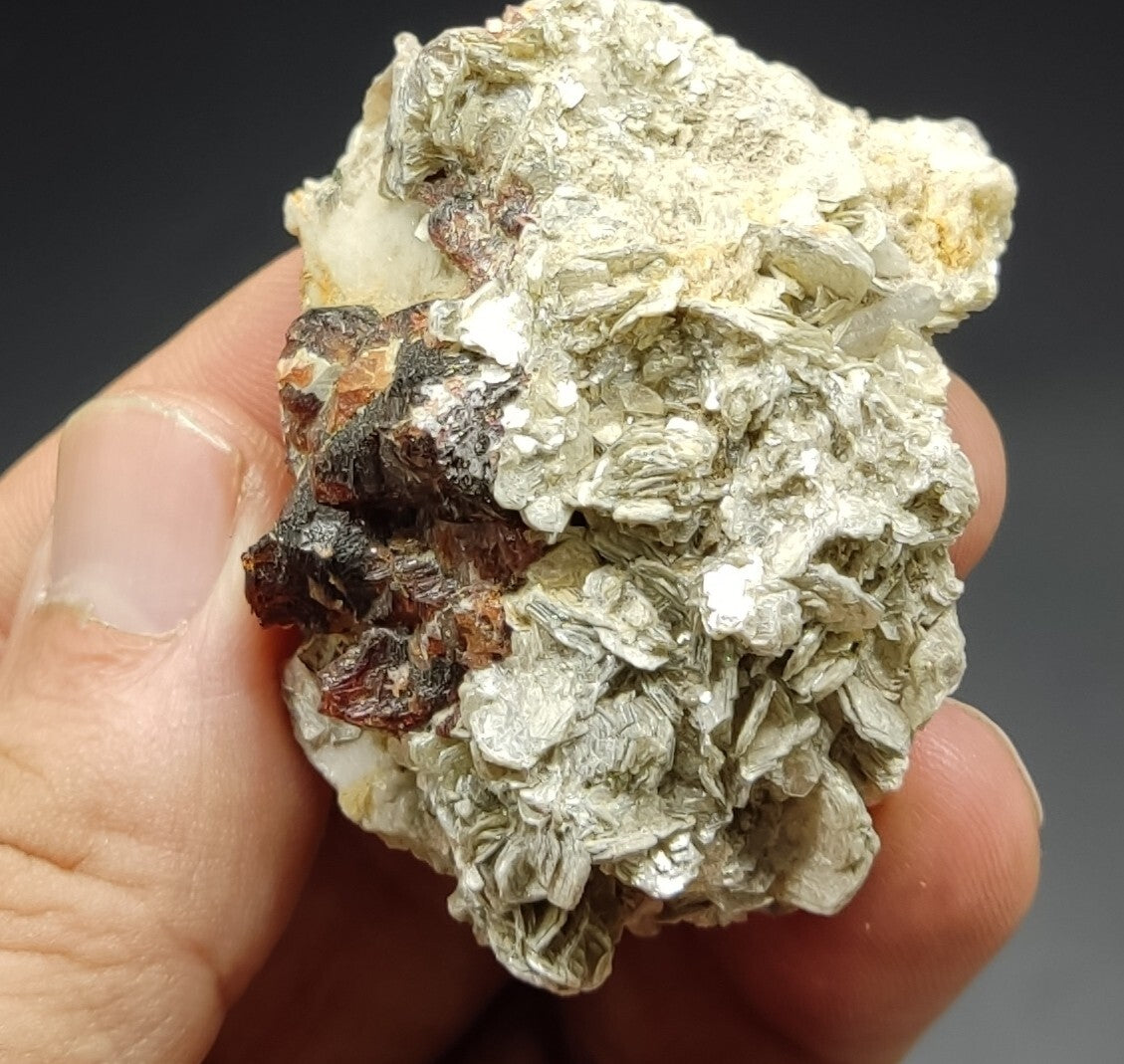 An aesthetic specimen of spessartine garnets on muscovite 58 grams