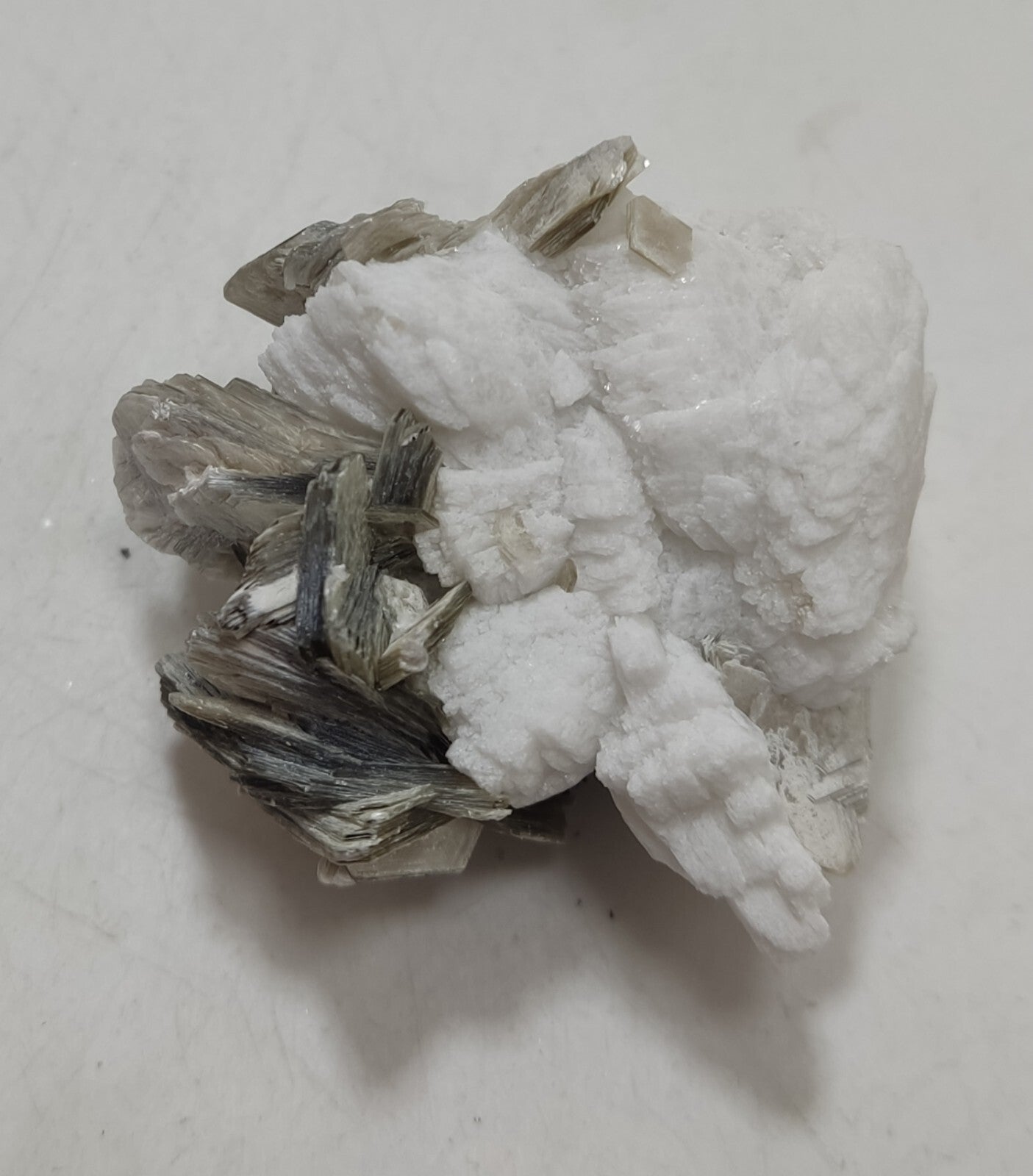 An Aesthetic specimen of muscovite with Tourmaline and albite 40 grams