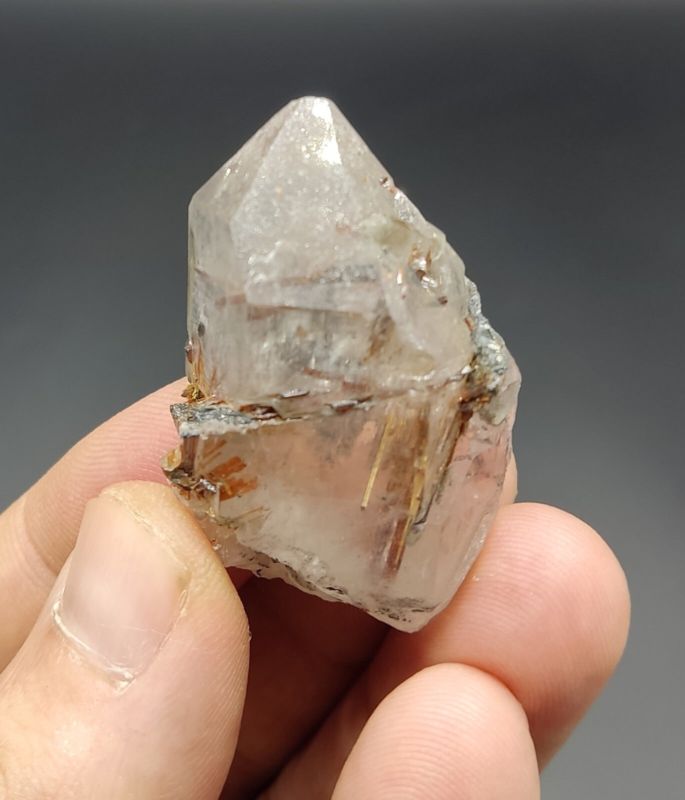 An aesthetic specimen of quartz with hematite and rutile inclusions 28 grams