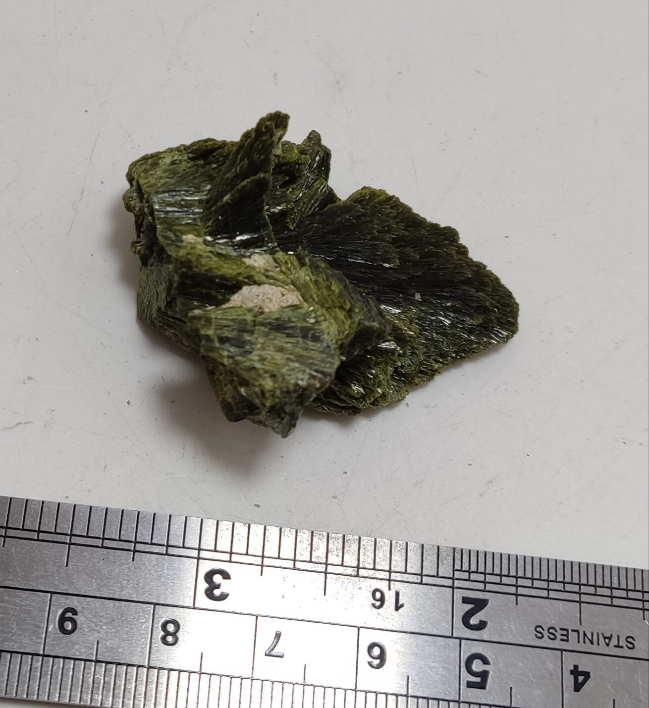 An aesthetic specimen of epidote crystal spray type 27 grams