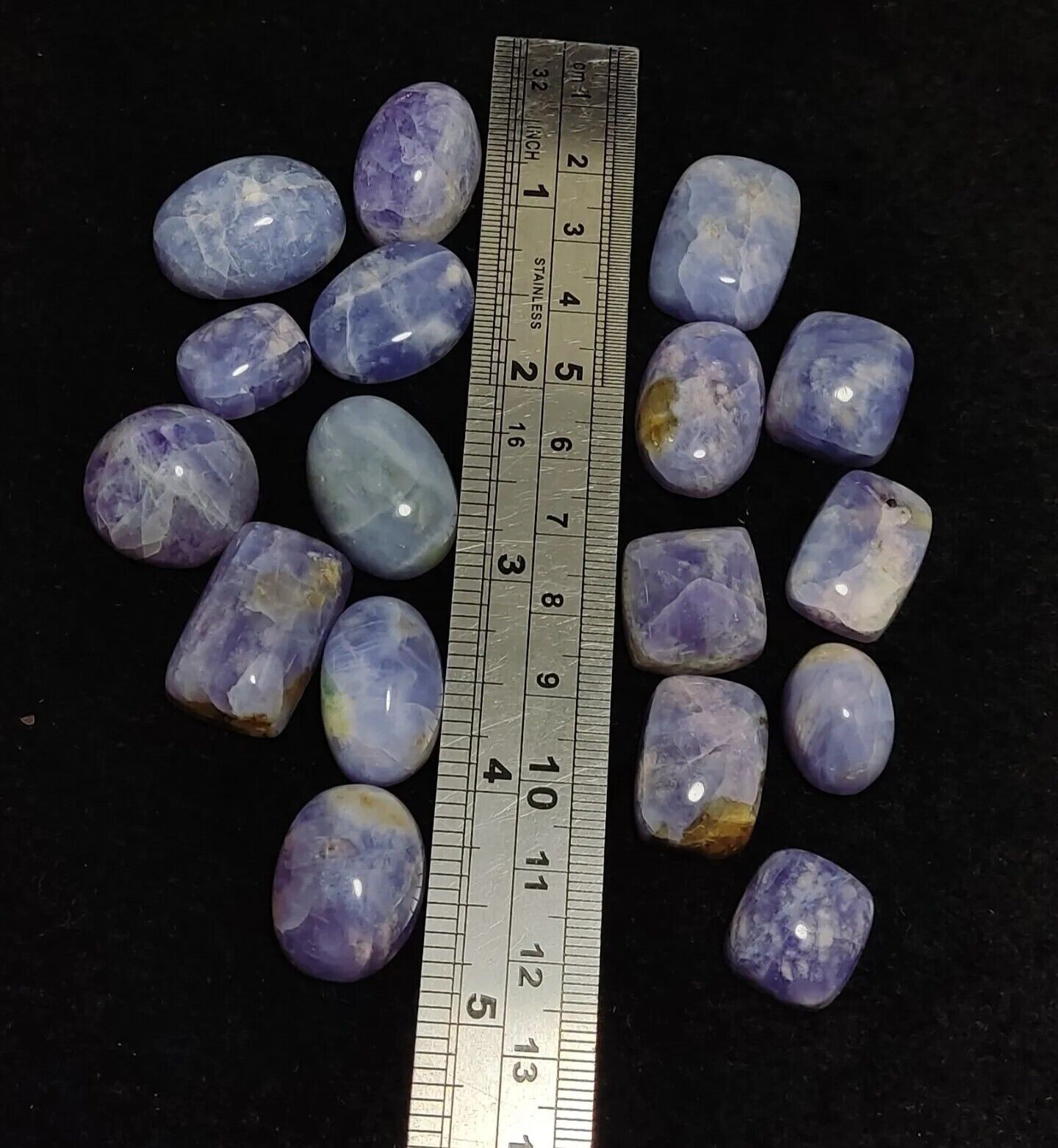 17 pieces Hackmanite cabochons  fluorescent collective weight 350 carats