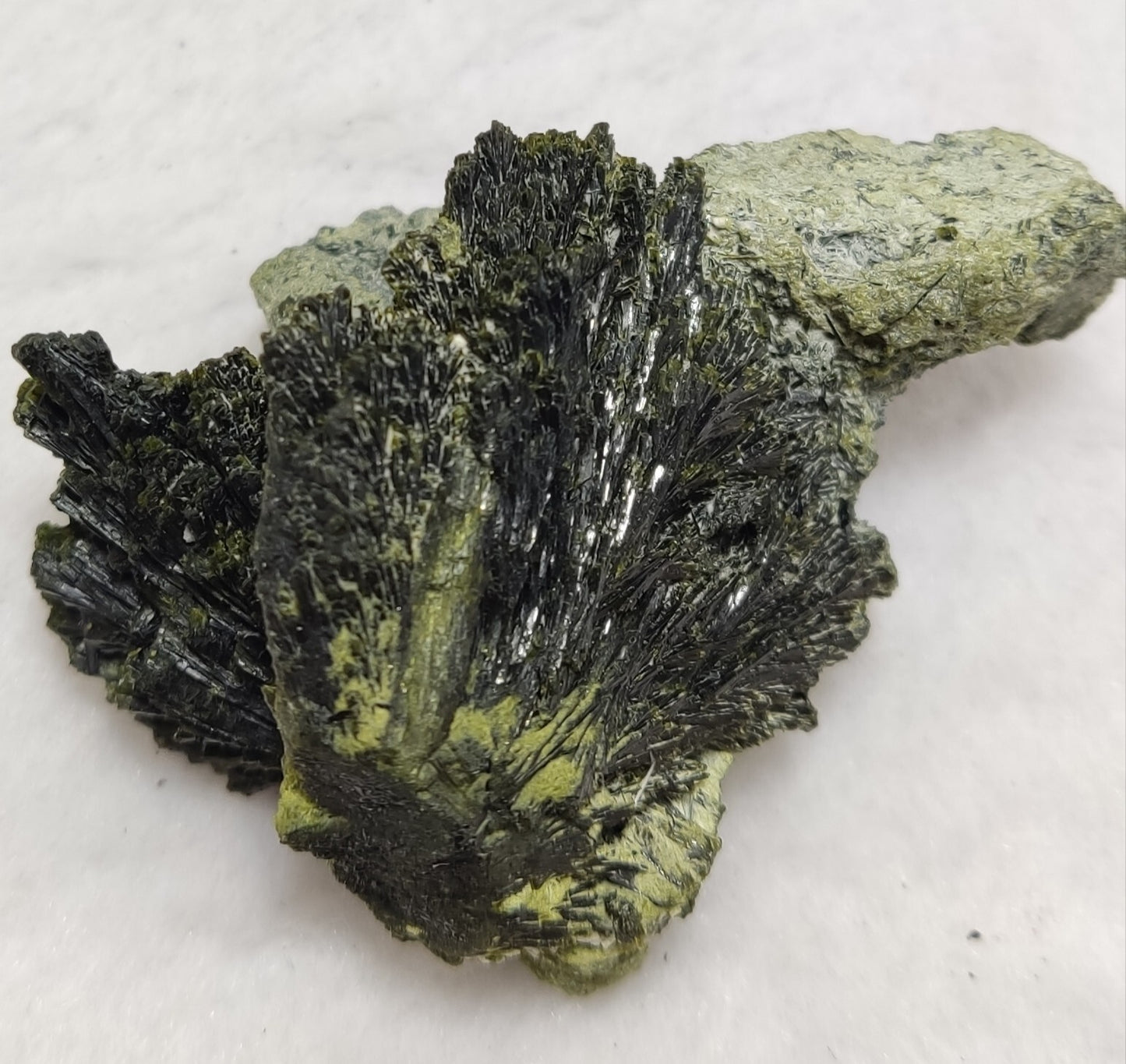 An aesthetic specimen of epidote crystal spray type 66 grams