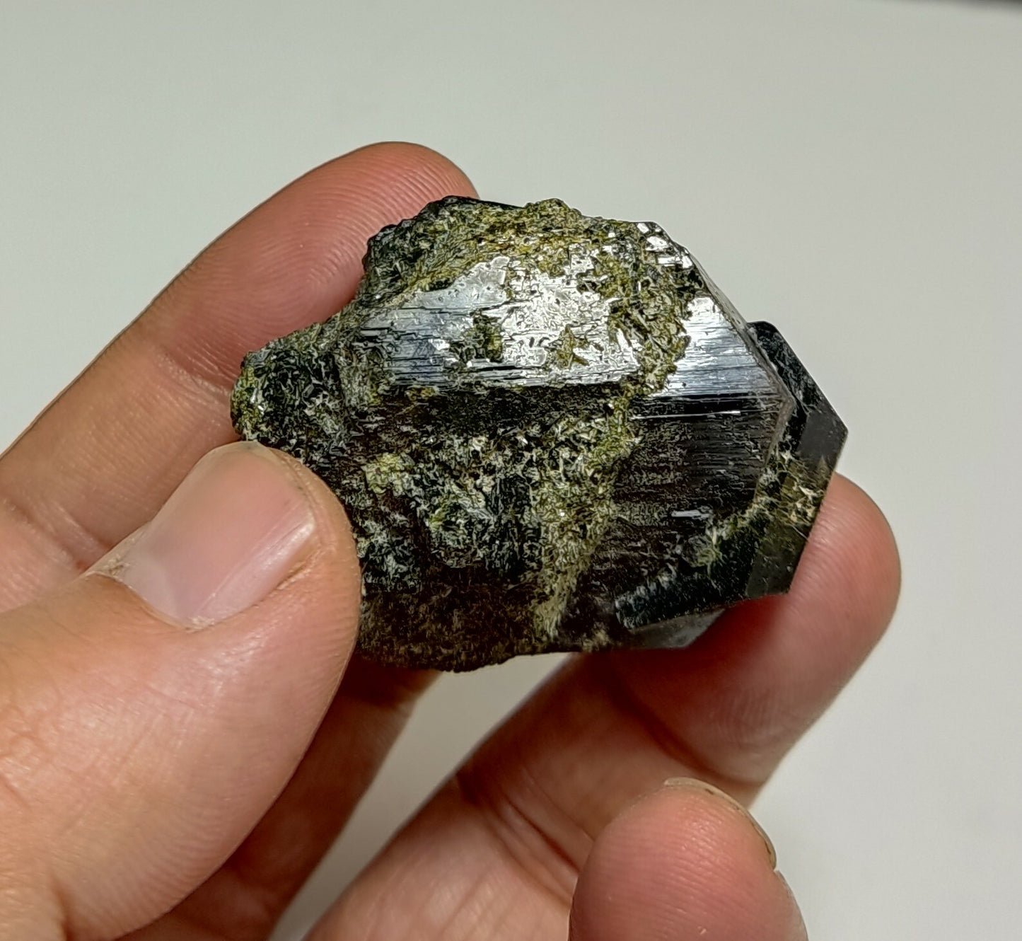 An aesthetic specimen of dark green color Epidote crystals 79 grams