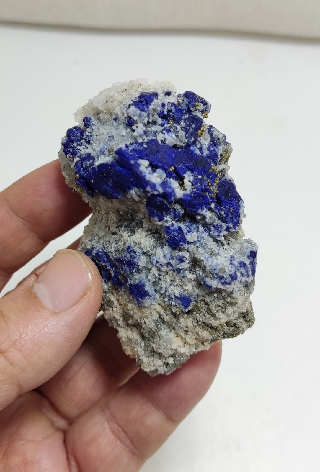 An Aesthetic specimen of fluorescent Lazurite with pyrite 112 grams