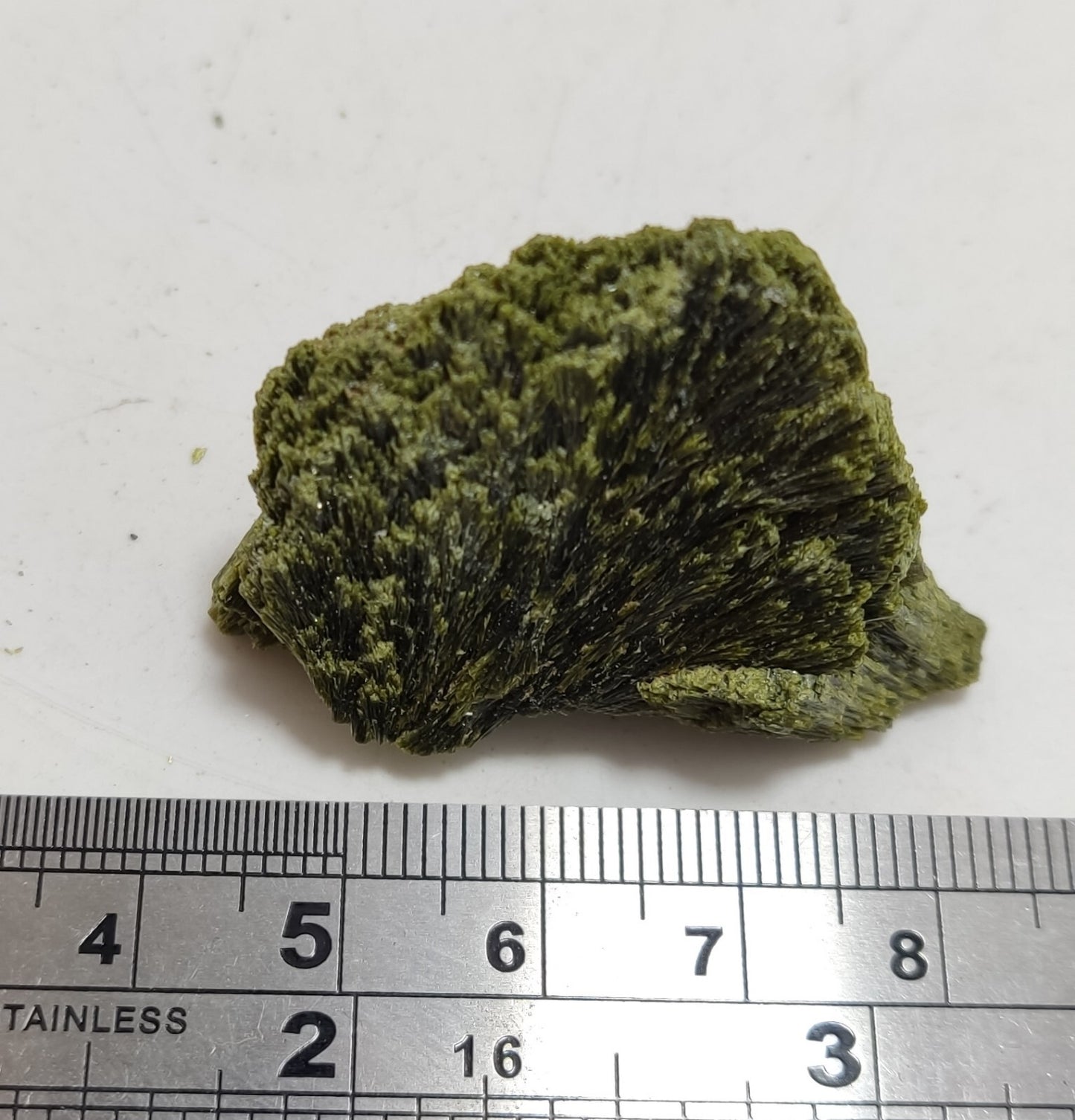 An aesthetic specimen of epidote crystal spray type 22 grams