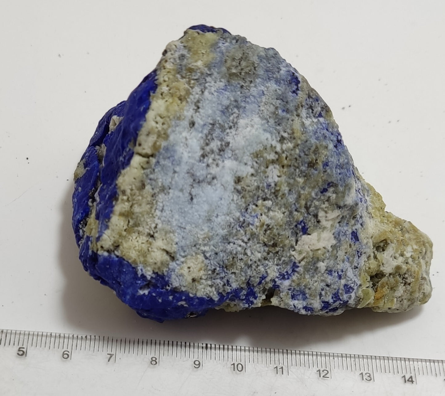 An Aesthetic specimen of fluorescent Lazurite with Pyrite 296 grams