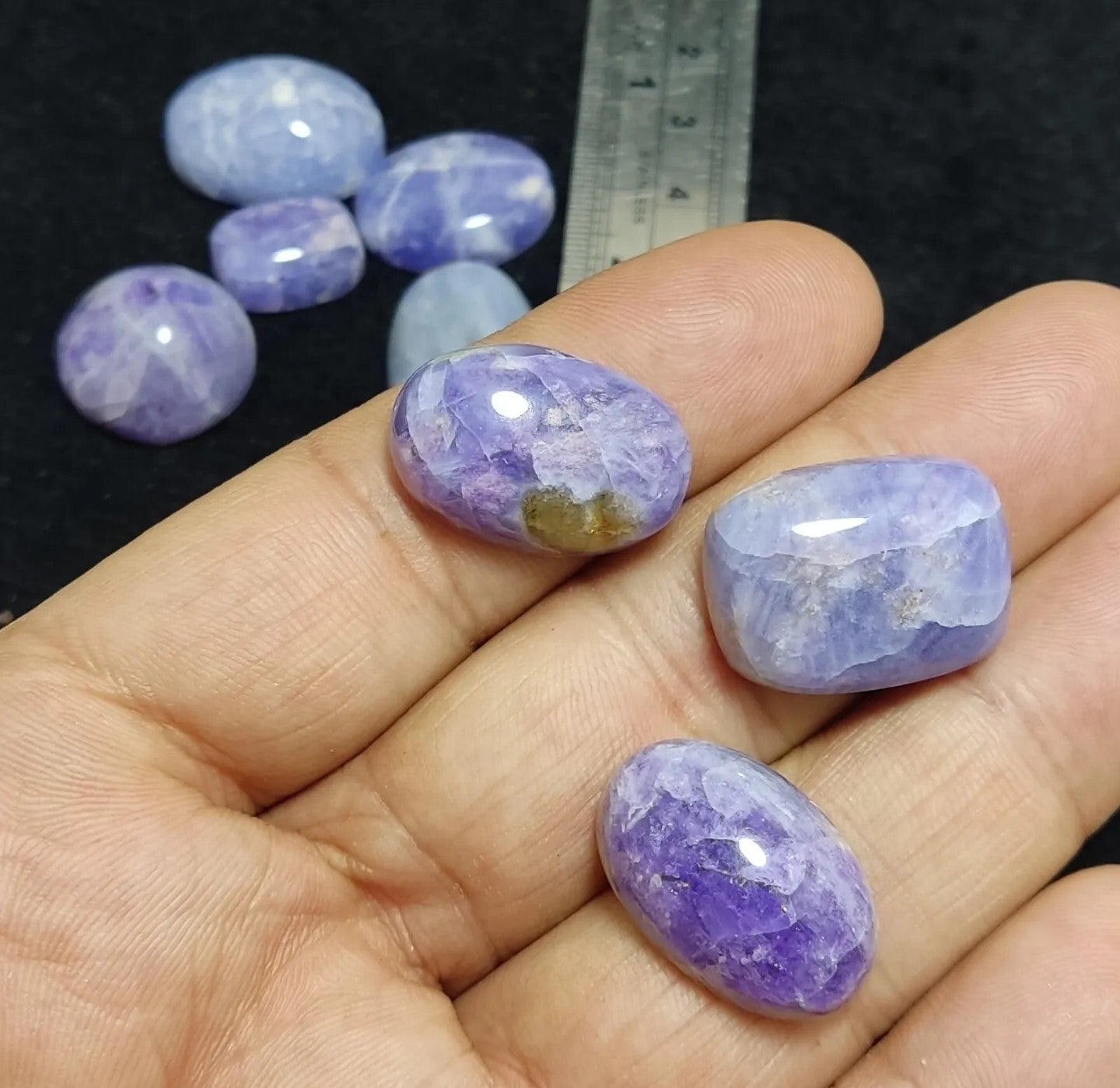 17 pieces Hackmanite cabochons  fluorescent collective weight 350 carats