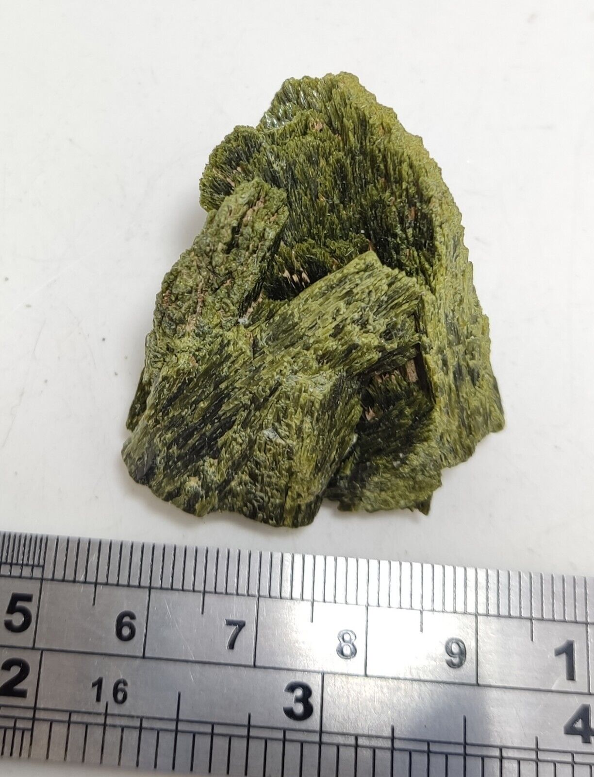 An aesthetic specimen of epidote crystal spray type 35 grams