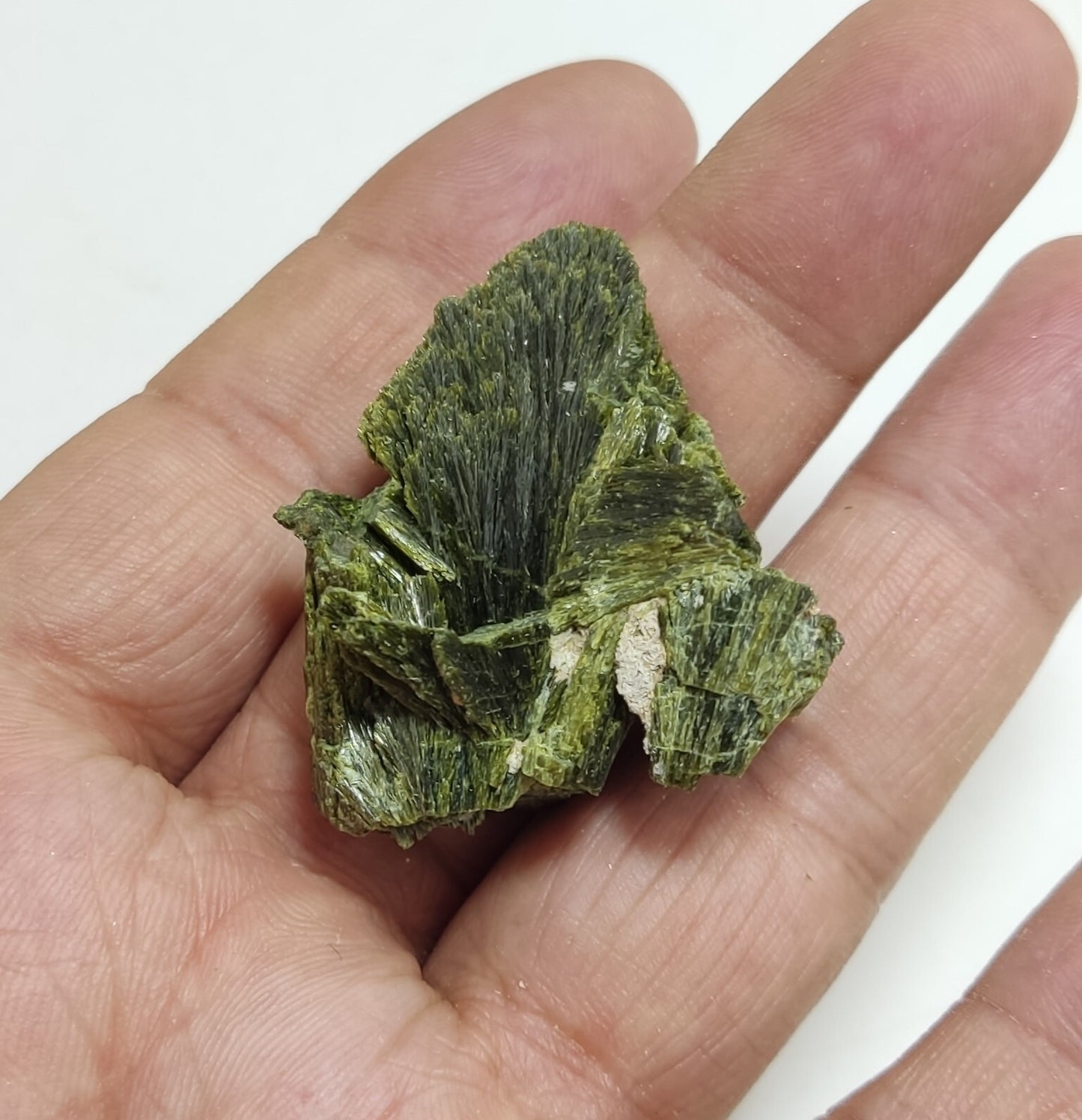 An aesthetic specimen of epidote crystal spray type 27 grams