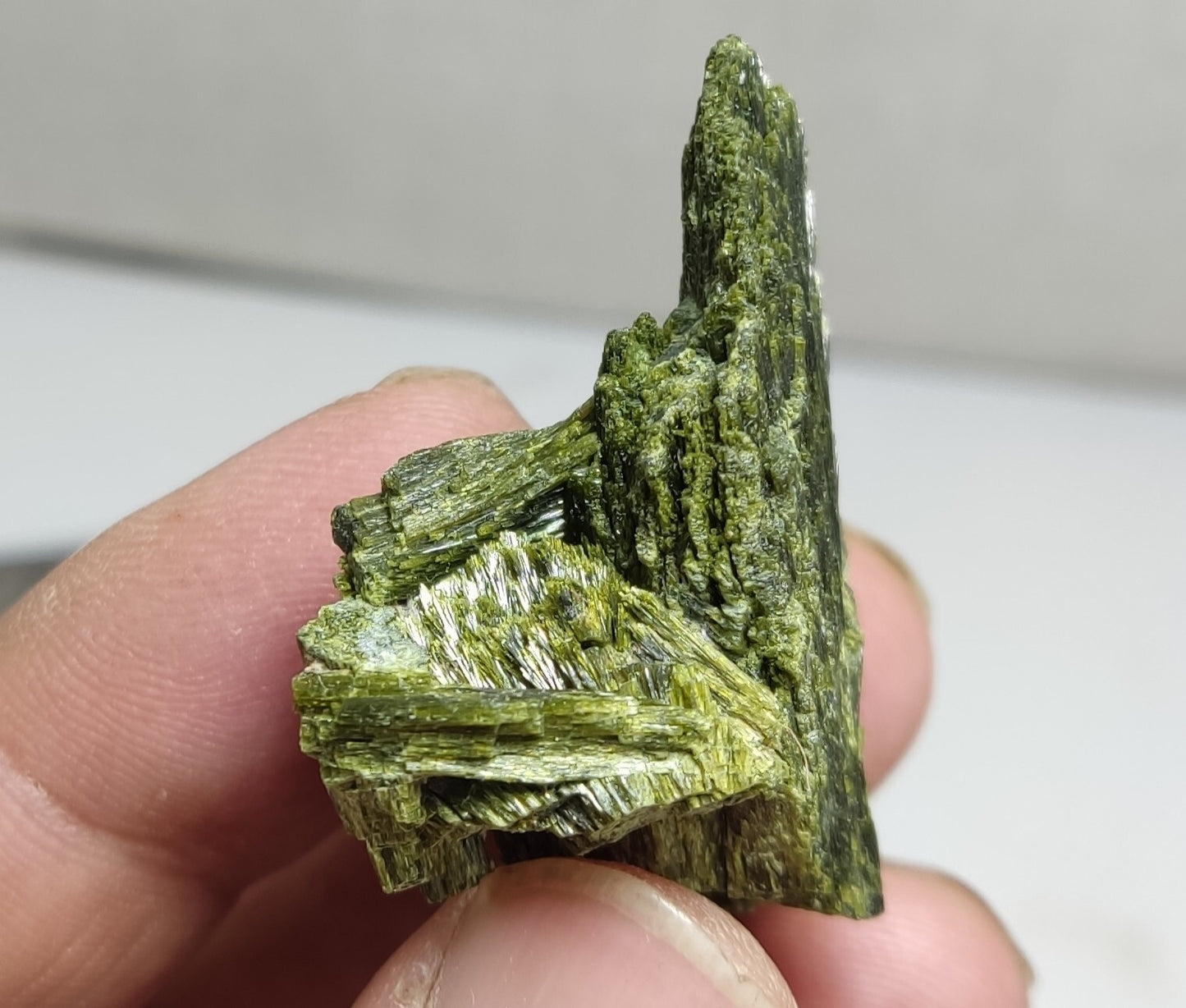 An aesthetic specimen of epidote crystal spray type 27 grams