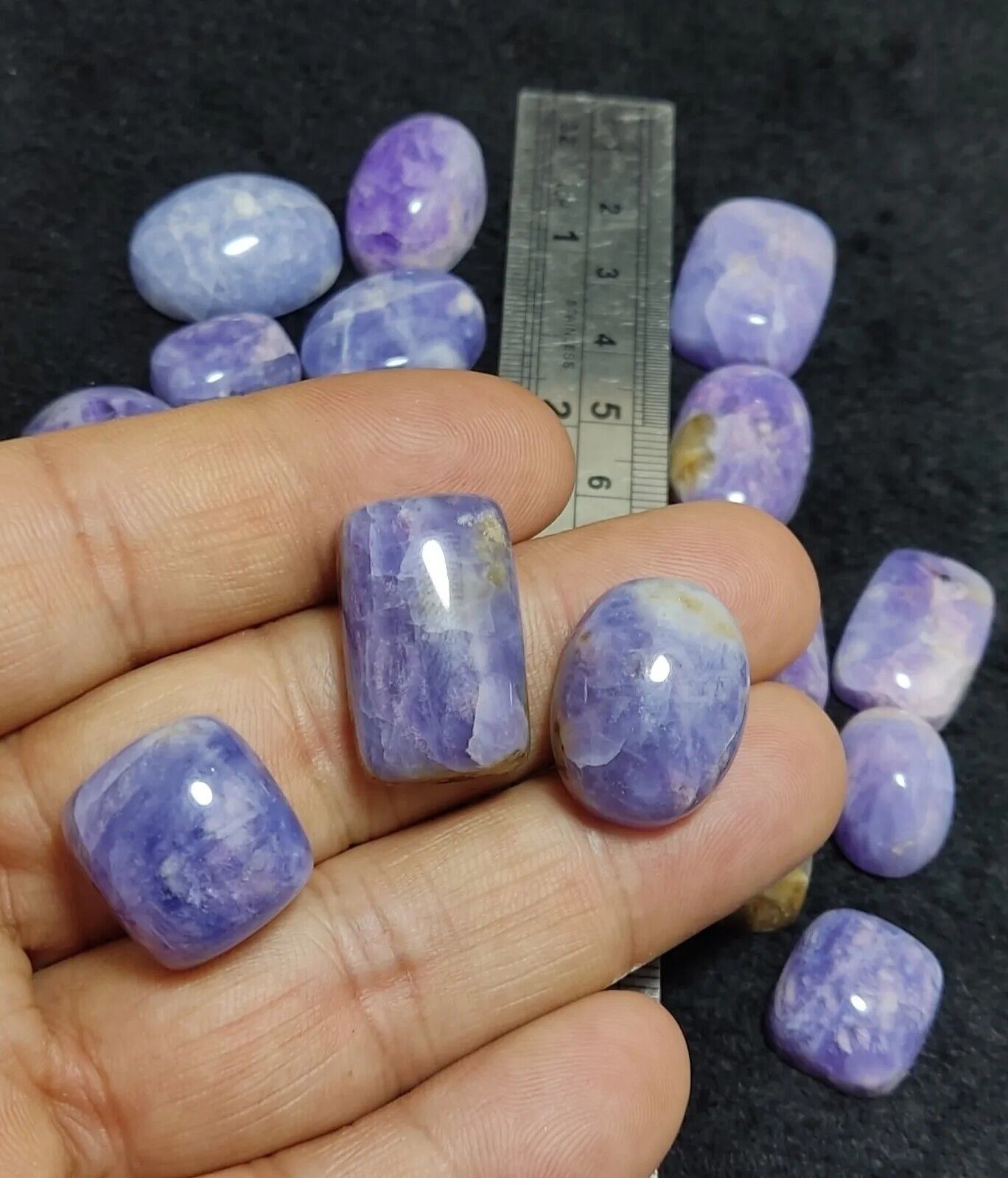 17 pieces Hackmanite cabochons  fluorescent collective weight 350 carats