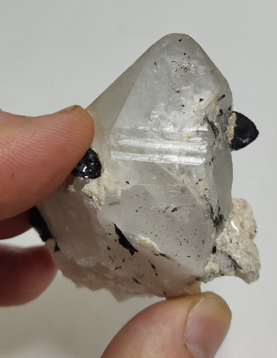 Natural quartz crystal with black tourmaline 129 grams