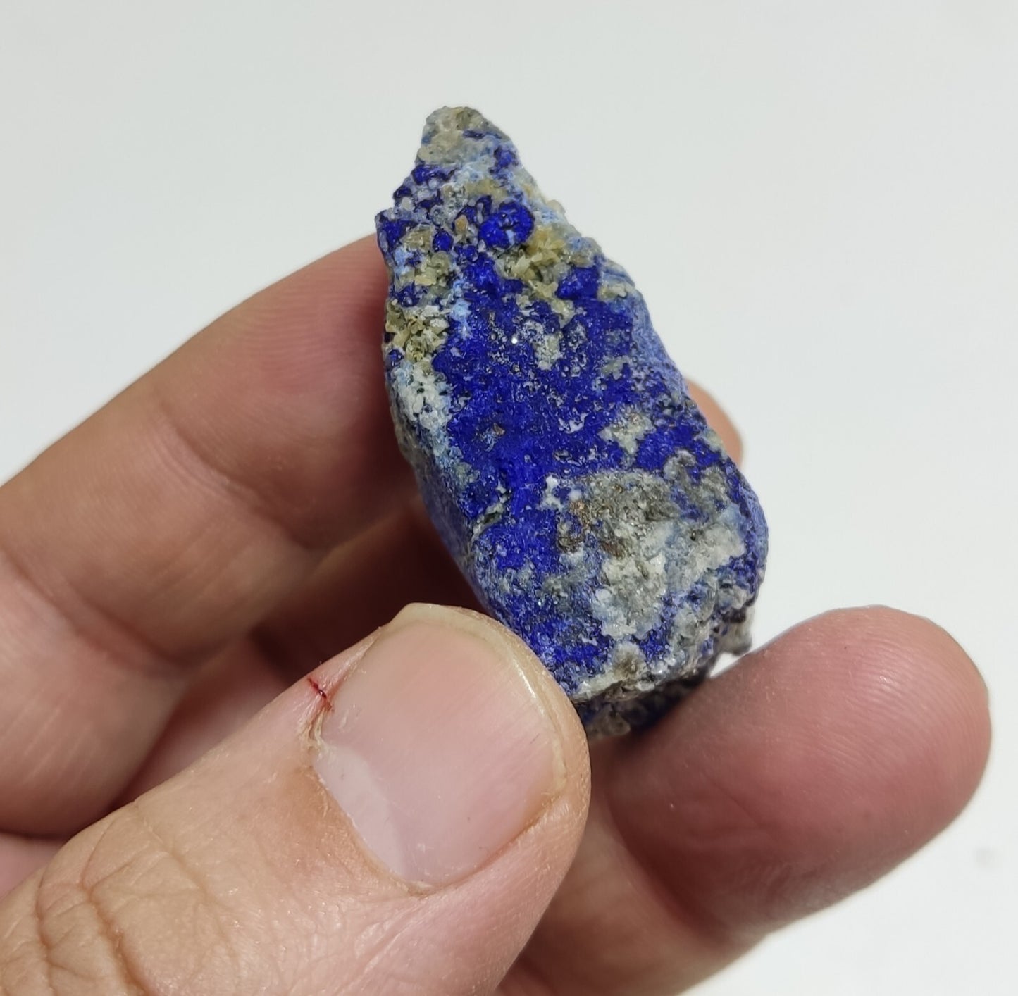 An Aesthetic specimen of fluorescent Lazurite with pyrite 27 grams