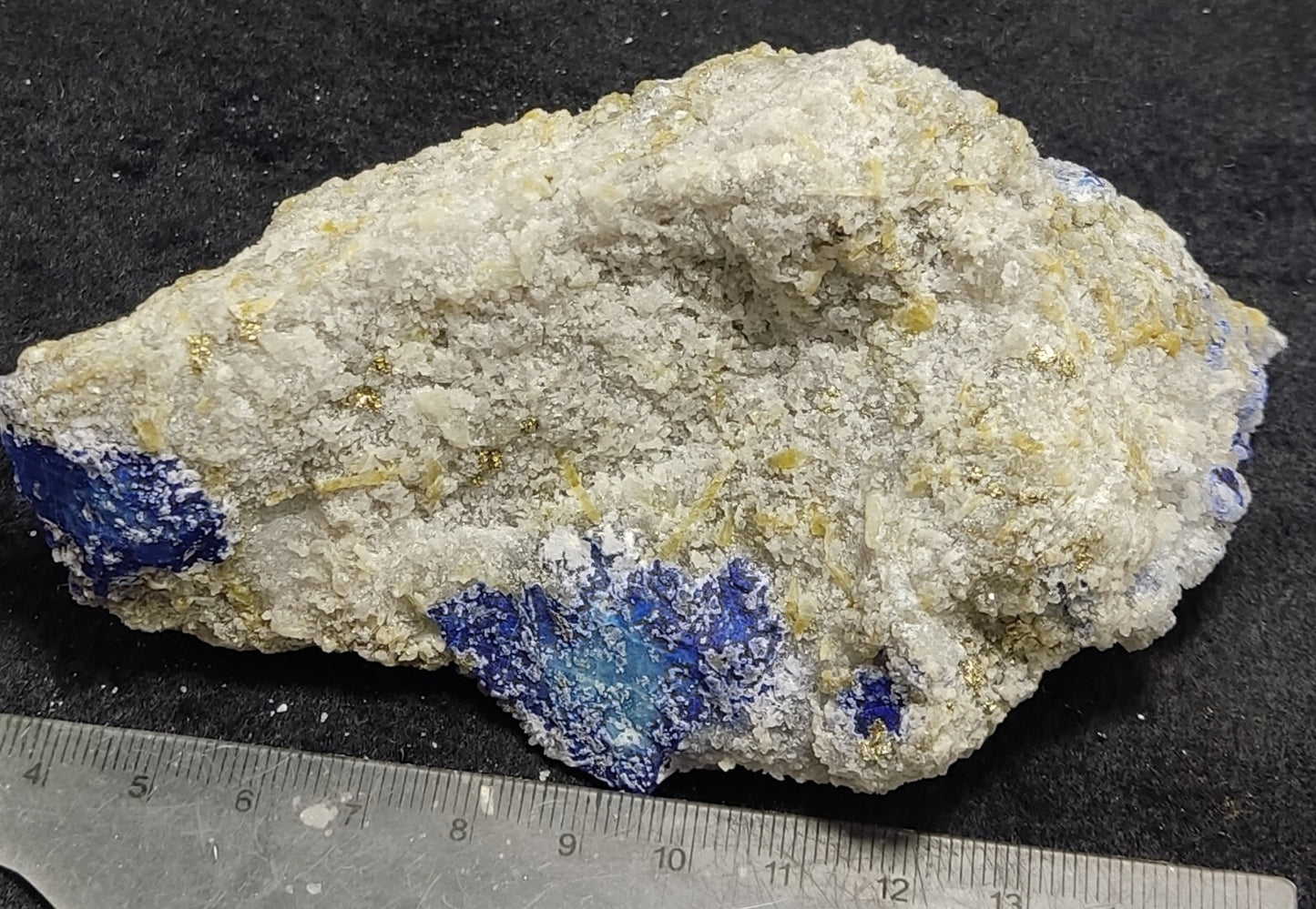 An Aesthetic specimen of fluorescent Lazurite with pyrite 415 grams