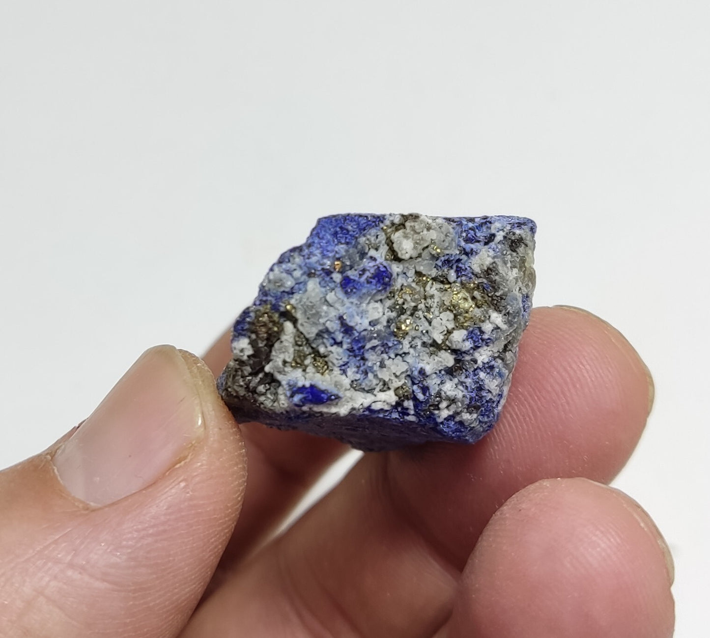 An Aesthetic specimen of fluorescent Lazurite with pyrite 27 grams