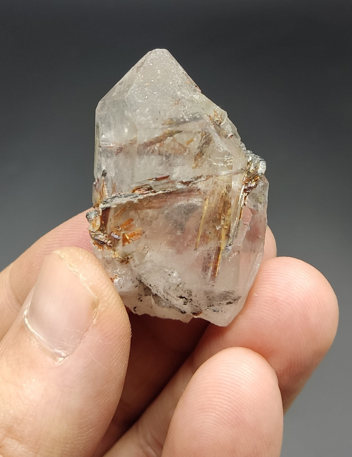 An aesthetic specimen of quartz with hematite and rutile inclusions 28 grams