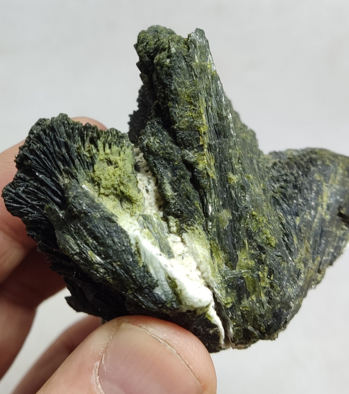 An aesthetic specimen of epidote crystal spray type on matrix 182 grams