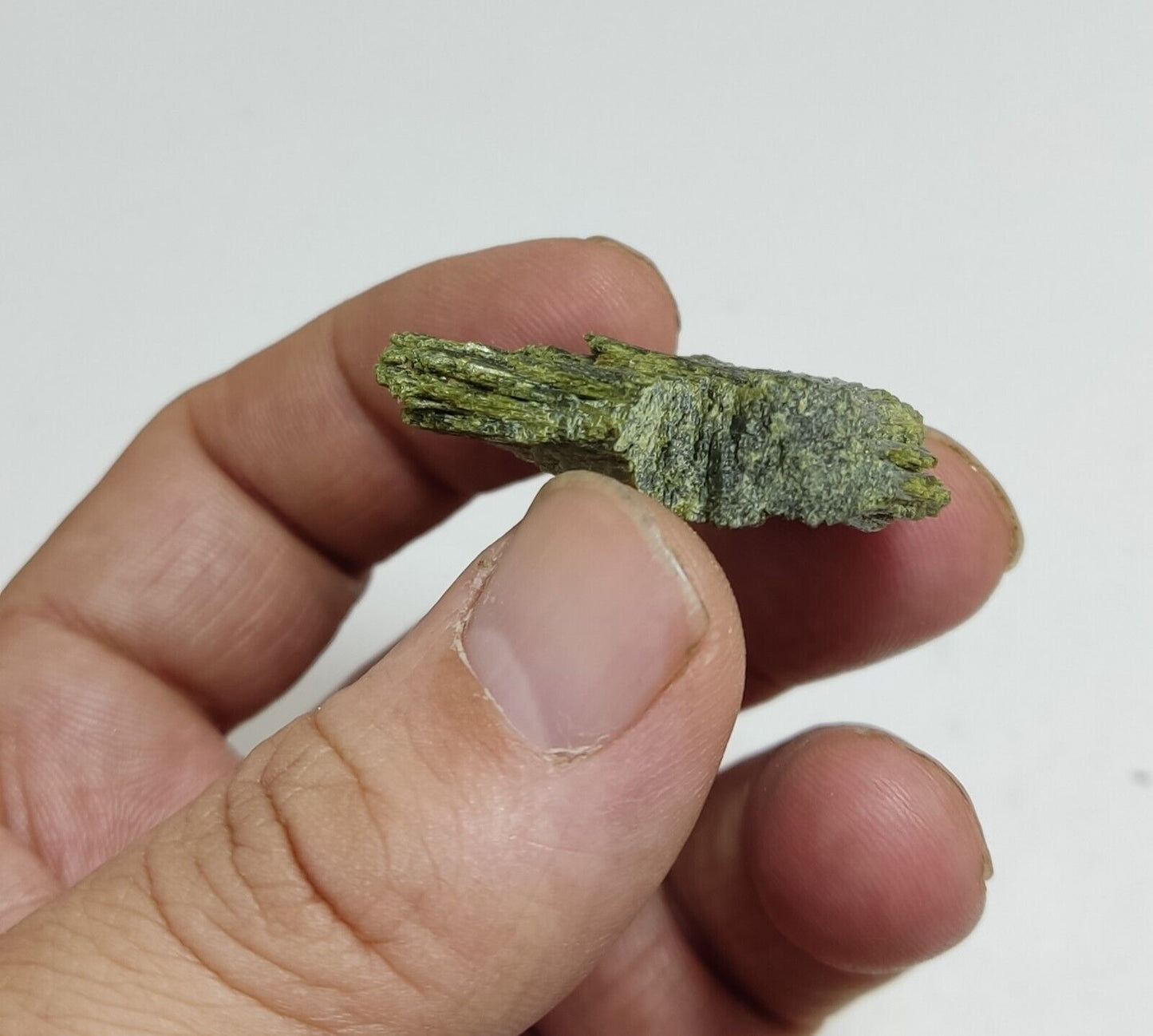 An aesthetic specimen of epidote crystal spray type 22 grams
