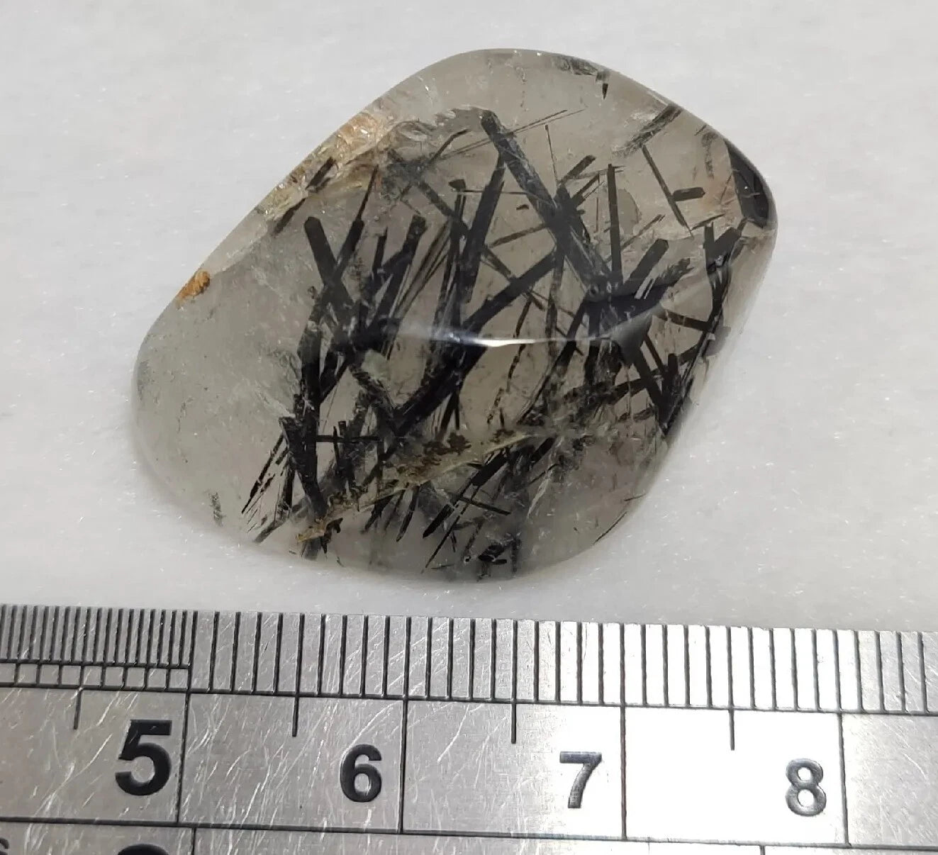 Rutiles/aegirine/ Unconfirmed quartz polished tumble 75 carats