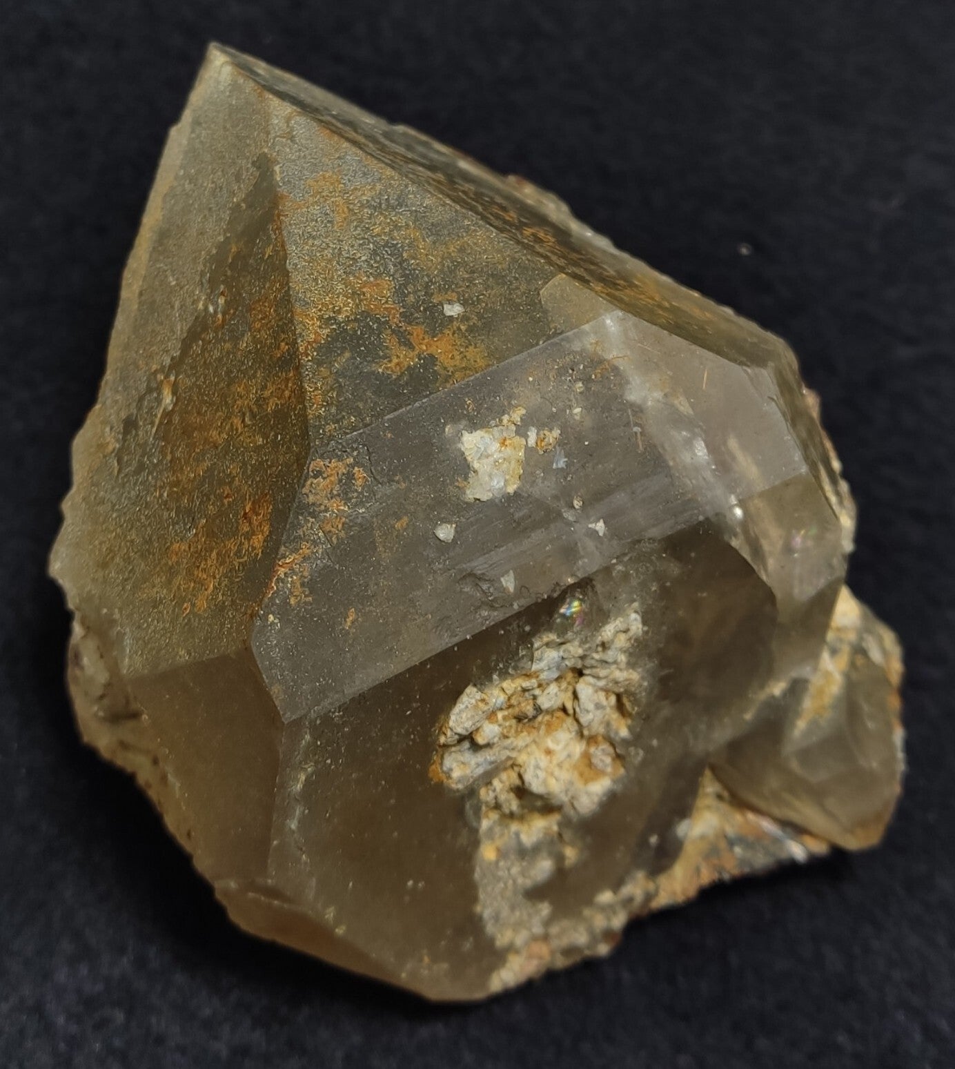 An Aesthetic terminated Quartz floater with rutiles and hematite 399 grams