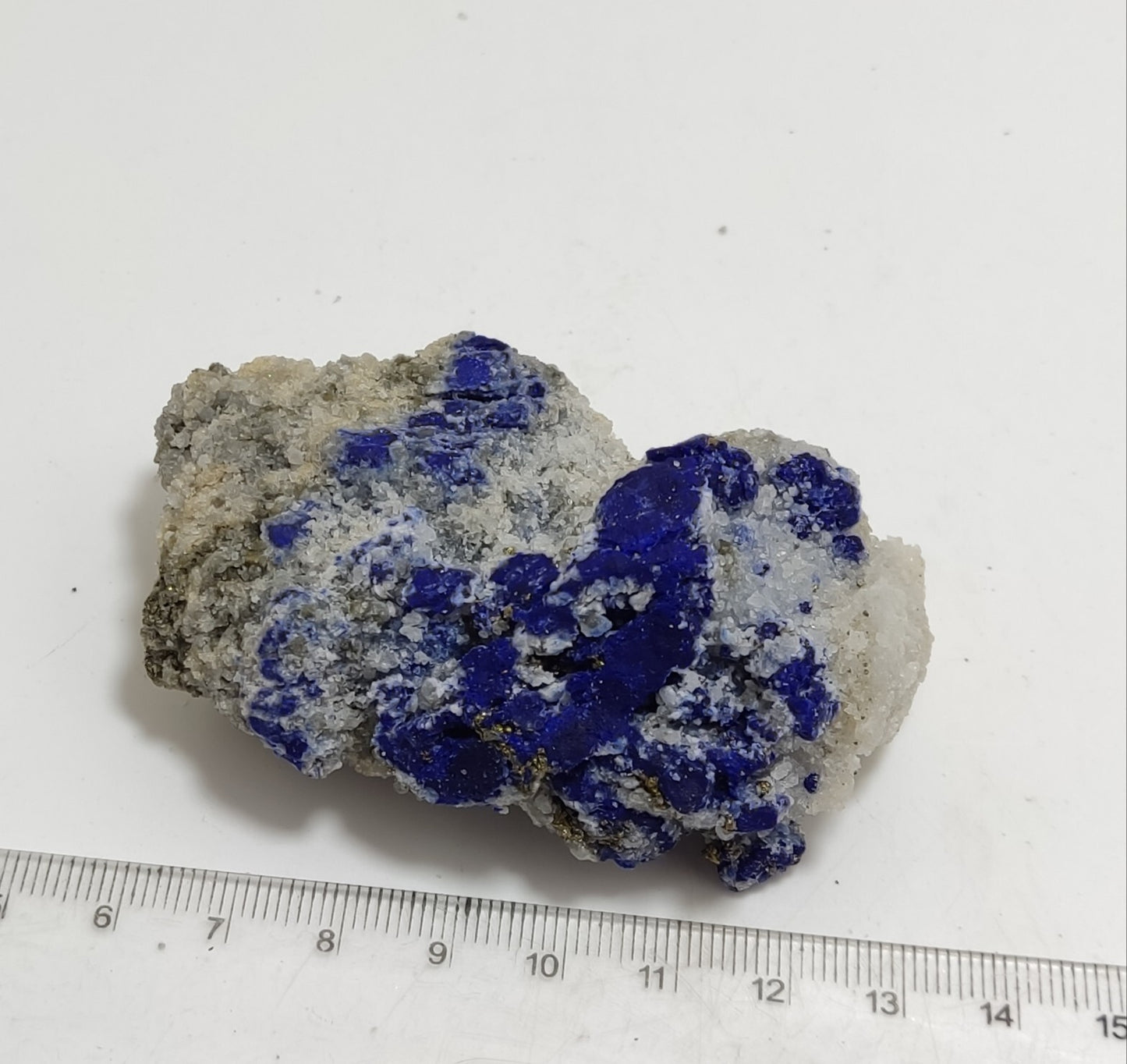 An Aesthetic specimen of fluorescent Lazurite with pyrite 112 grams