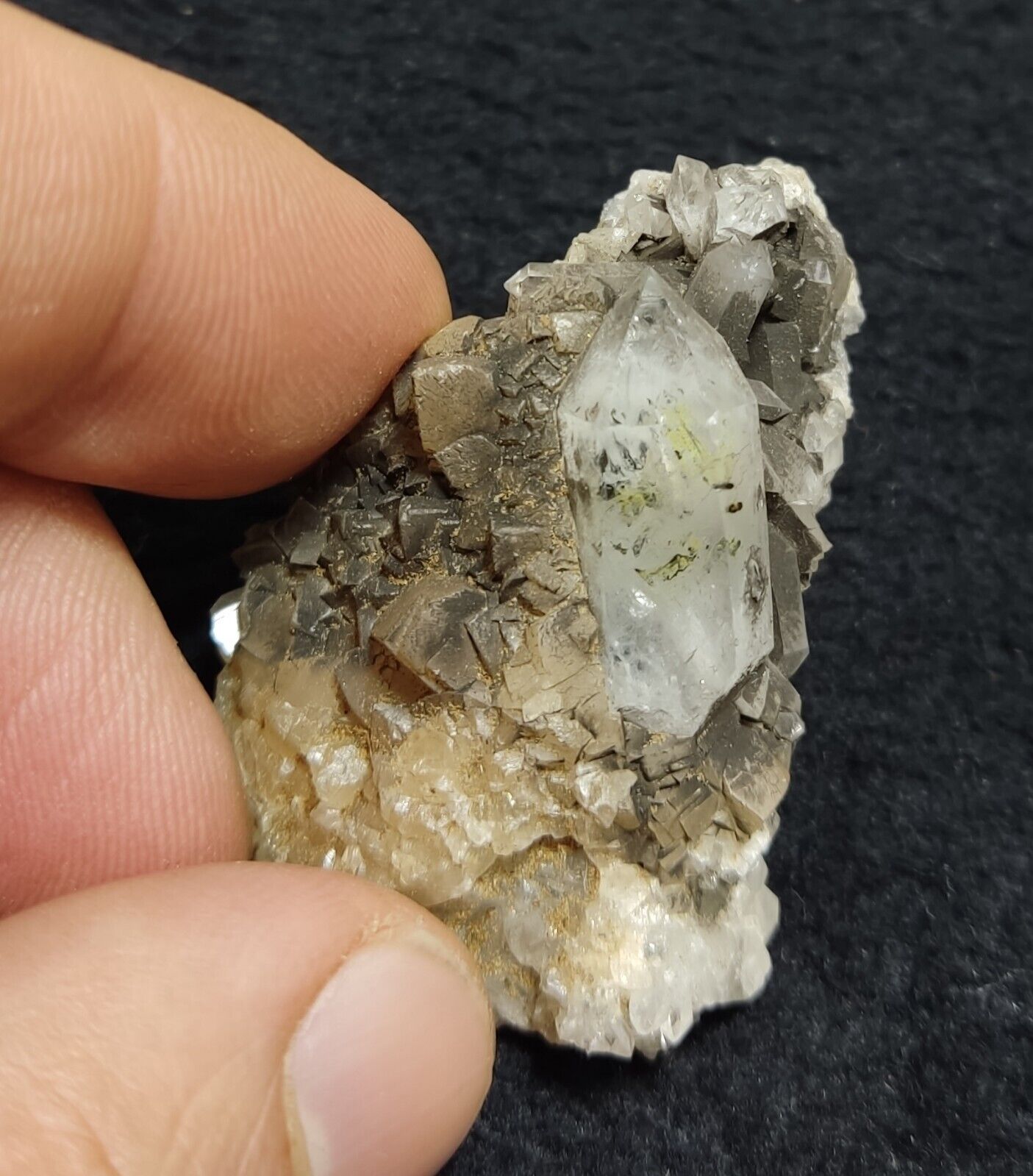 An Aesthetic quartz/calcite crystal specimen with petroleum inclusions 23 grams