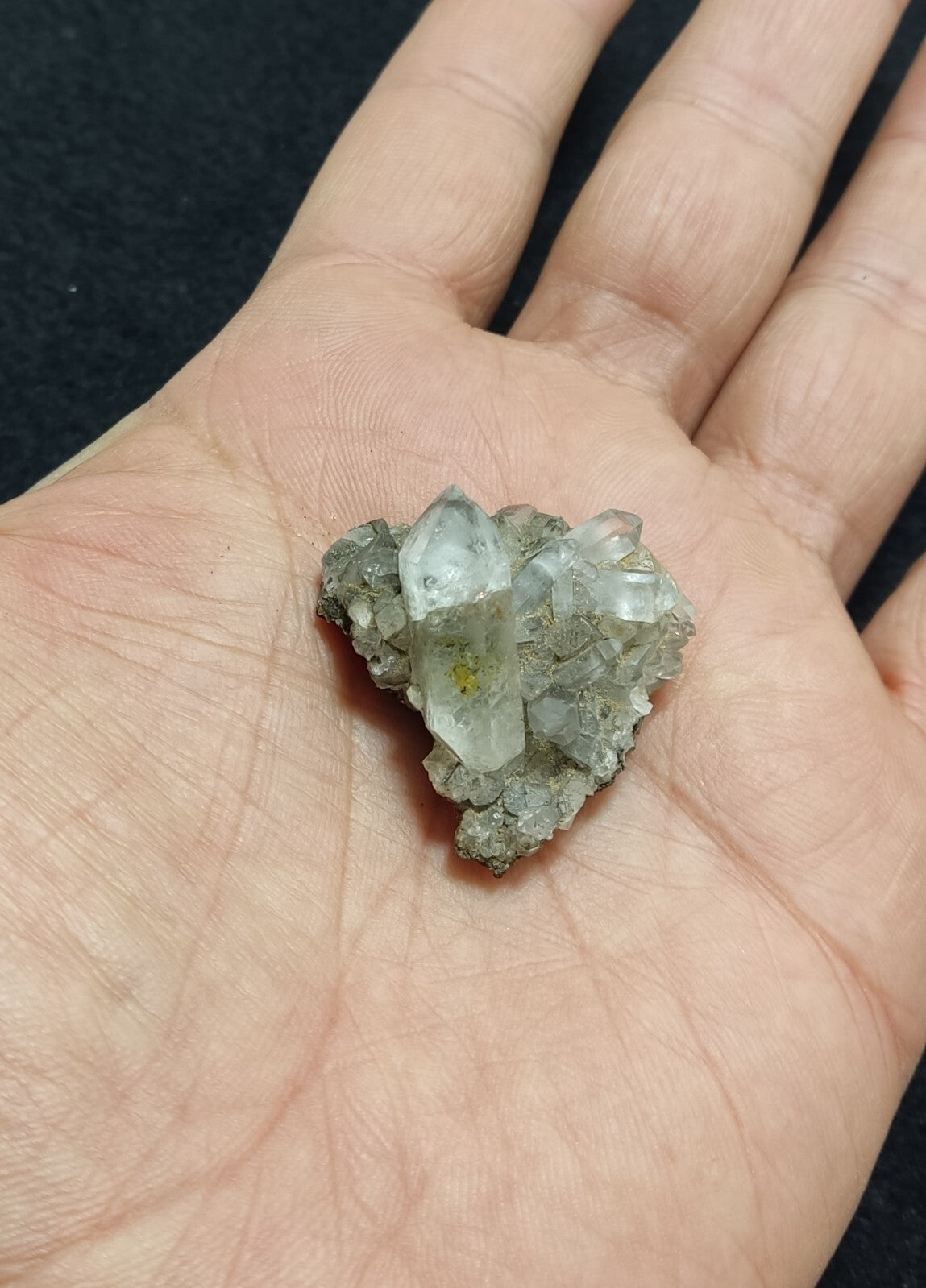 An Aesthetic quartz/calcite crystal specimen with petroleum inclusions 15 grams
