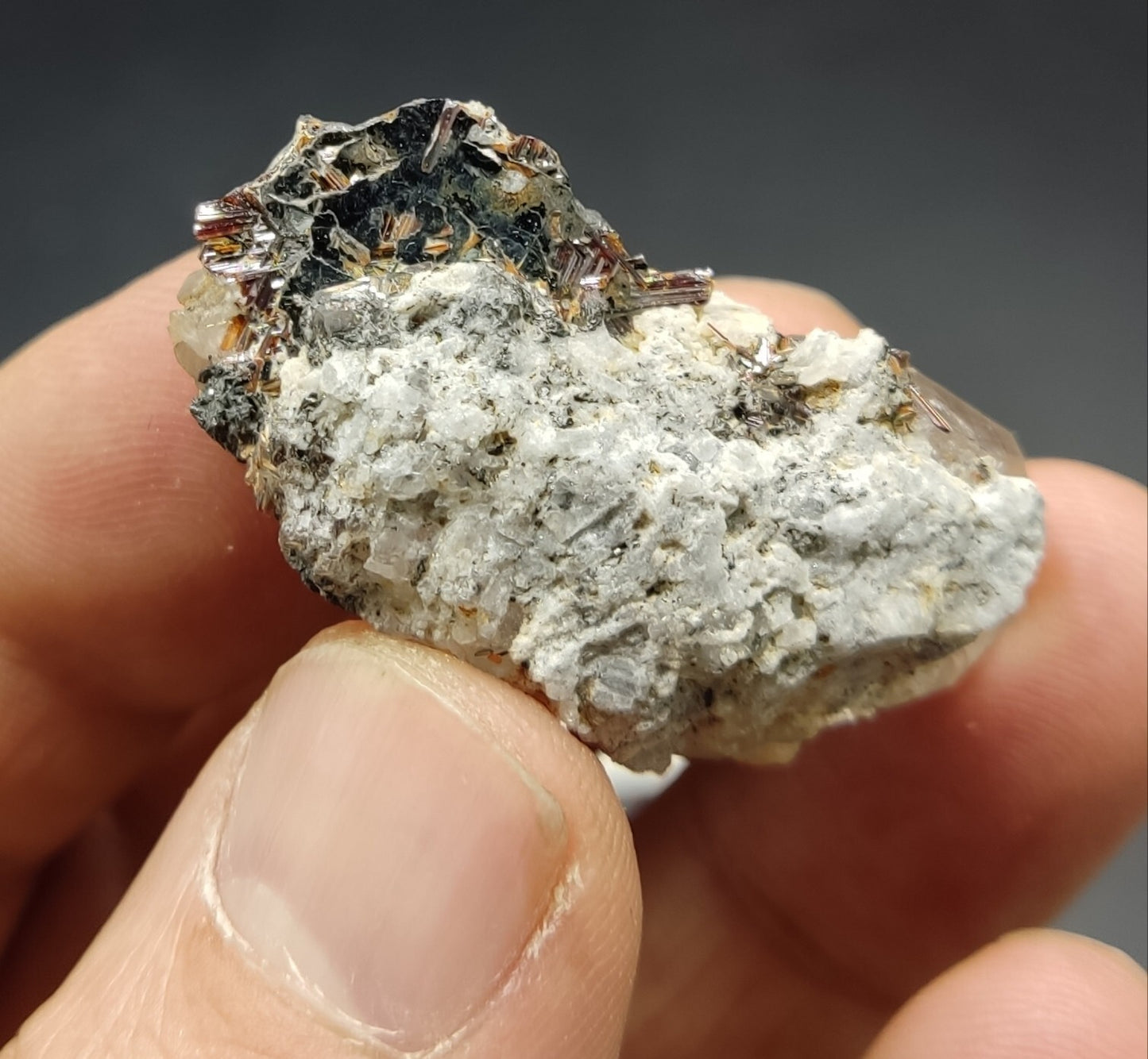 An Aesthetic specimen of quartz crystal with hematite and saginite 16 grams