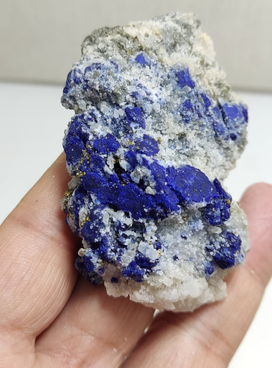 An Aesthetic specimen of fluorescent Lazurite with pyrite 112 grams