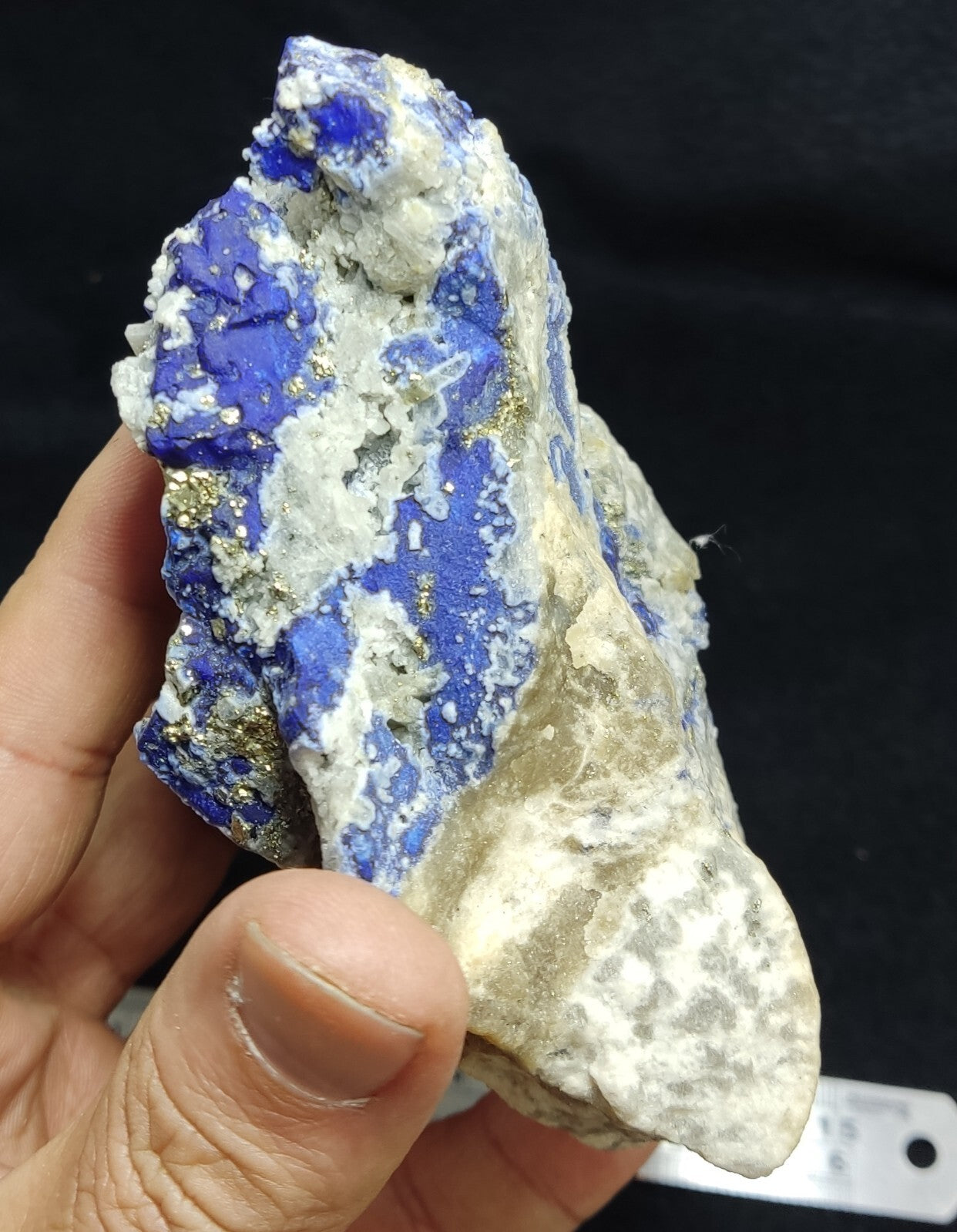 An Aesthetic specimen of fluorescent Lazurite with pyrite 489 grams