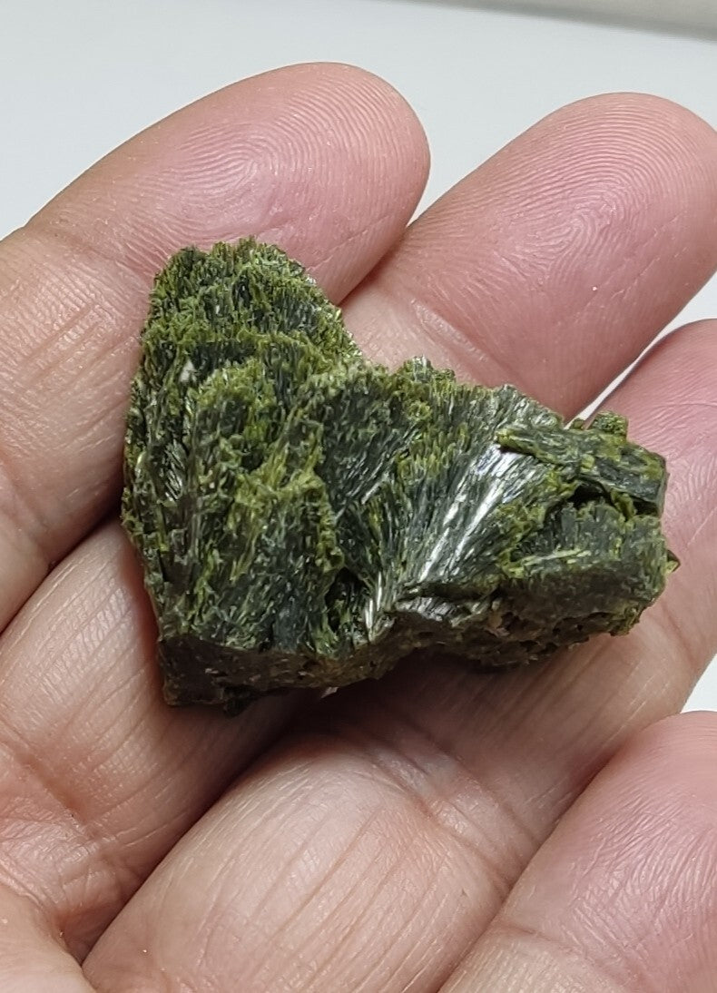 An aesthetic specimen of epidote crystal spray type 24 grams