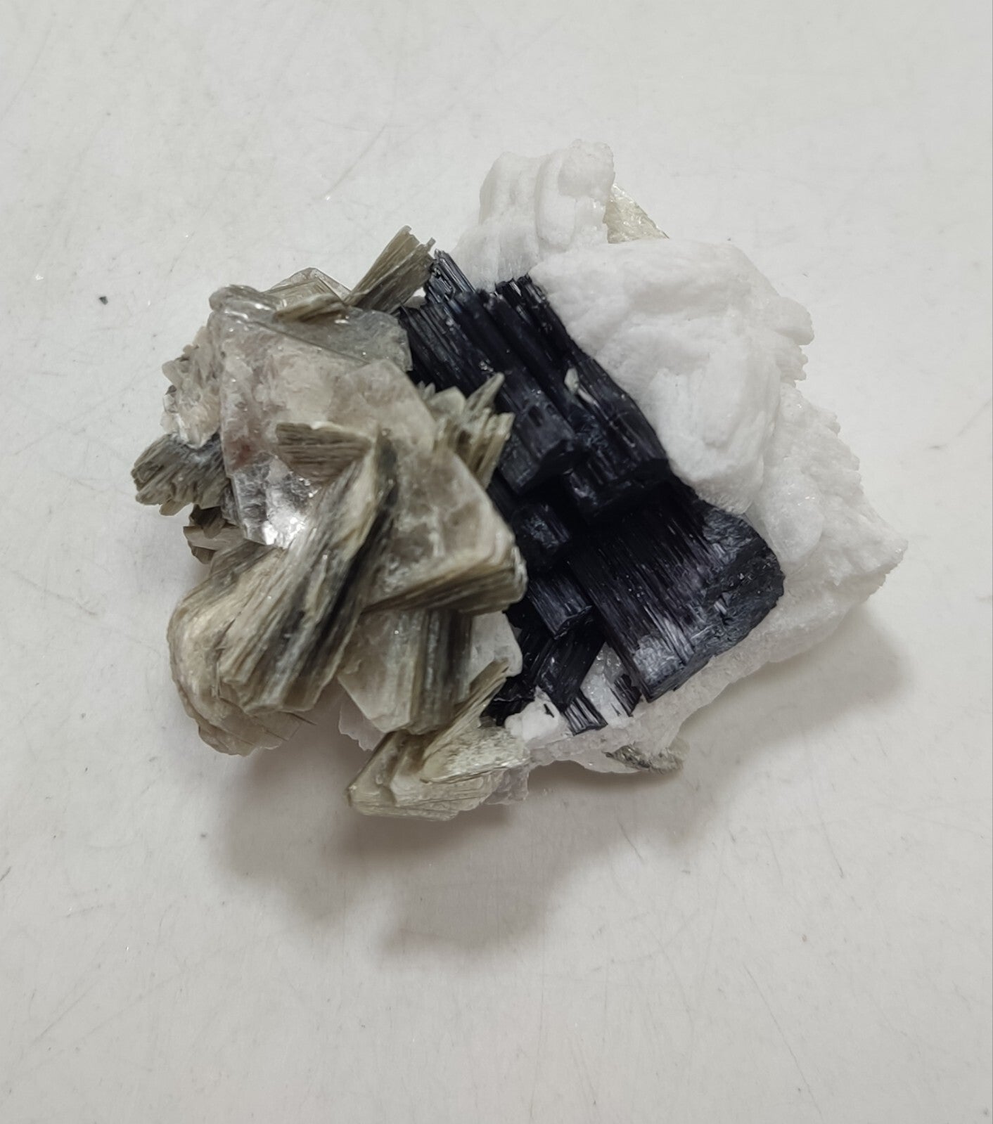 An Aesthetic specimen of muscovite with Tourmaline and albite 40 grams