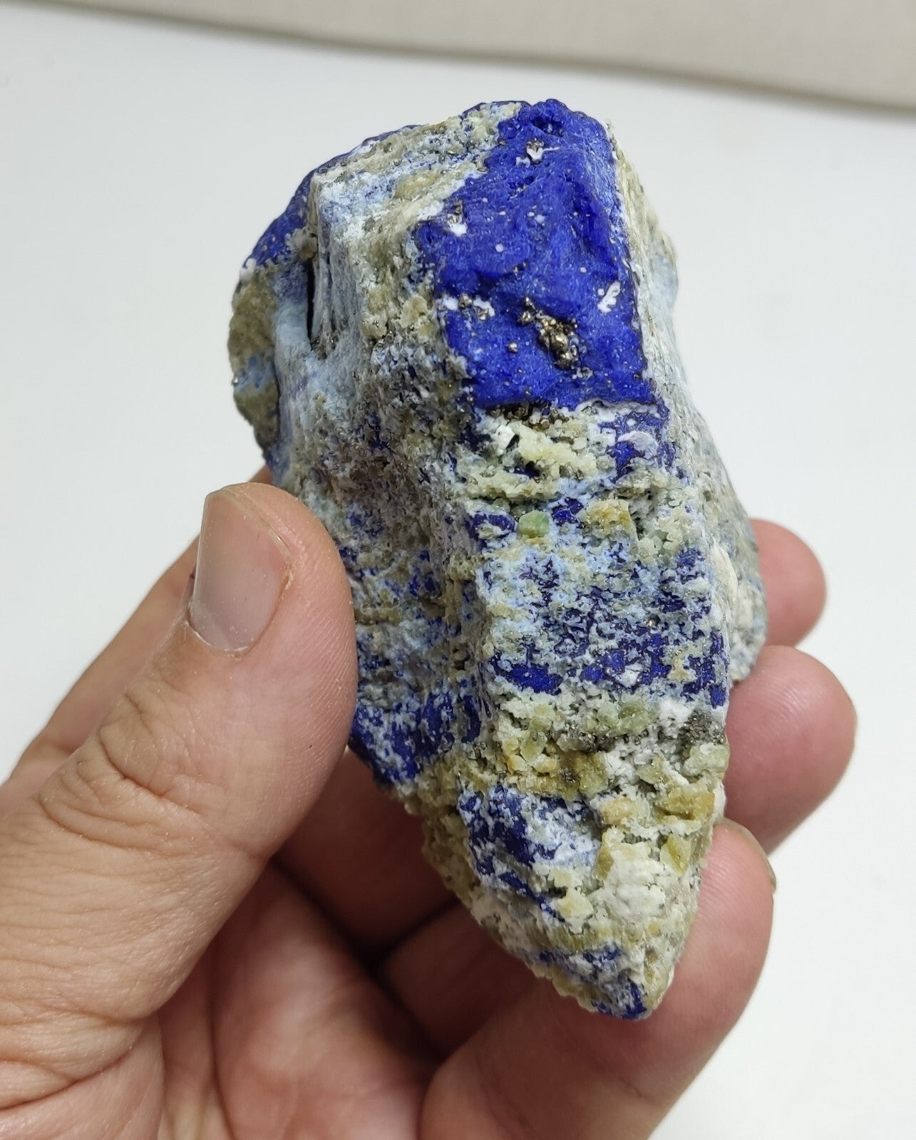 An Aesthetic specimen of fluorescent Lazurite with Pyrite 296 grams