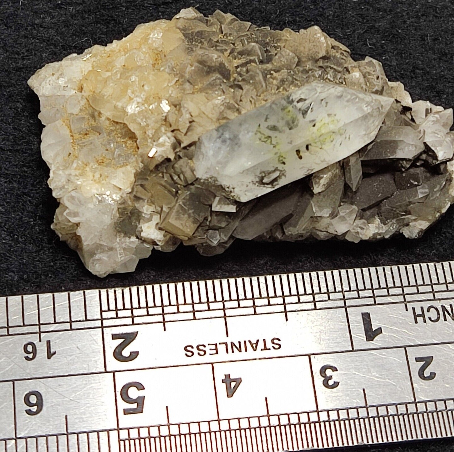 An Aesthetic quartz/calcite crystal specimen with petroleum inclusions 23 grams