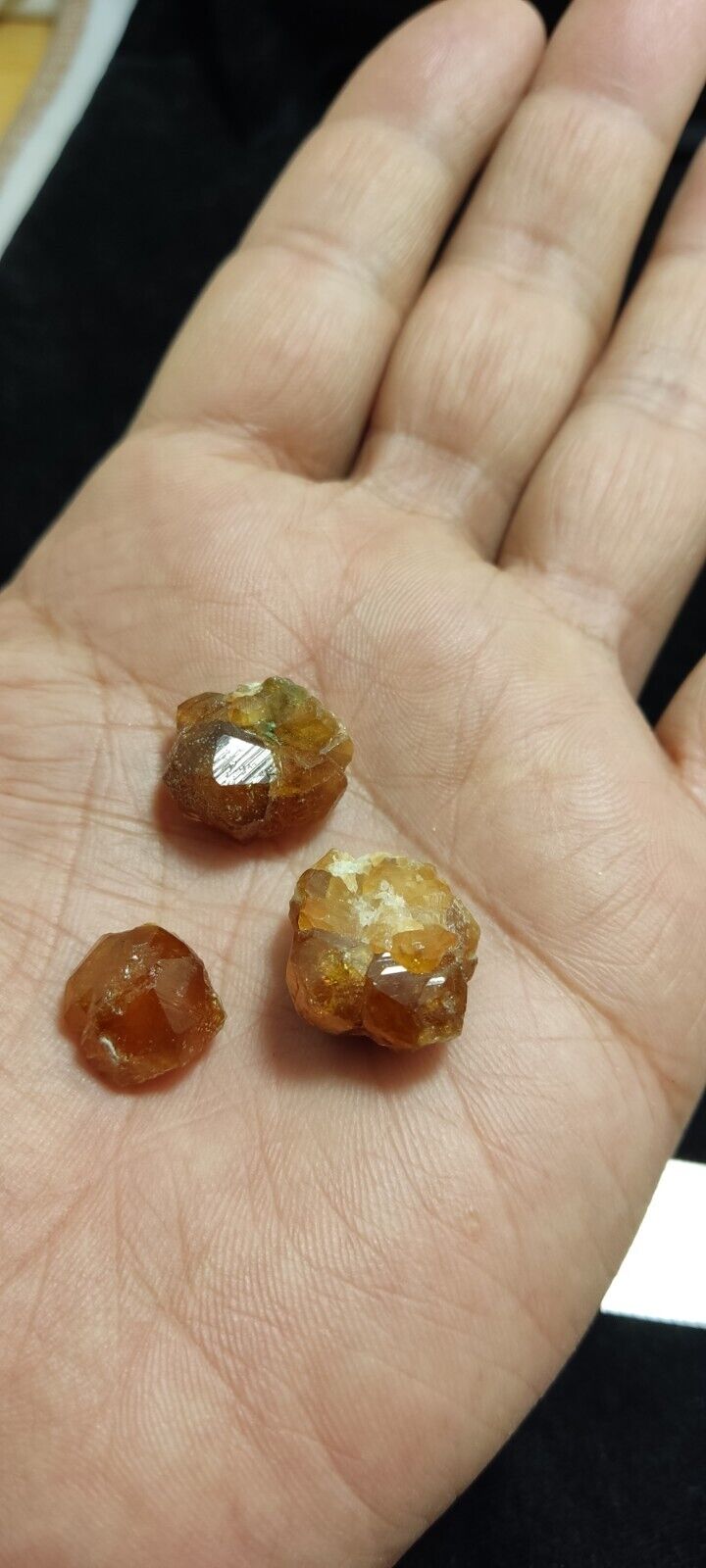 A selection of three garnet variety hessonite crystals 14.8 grams